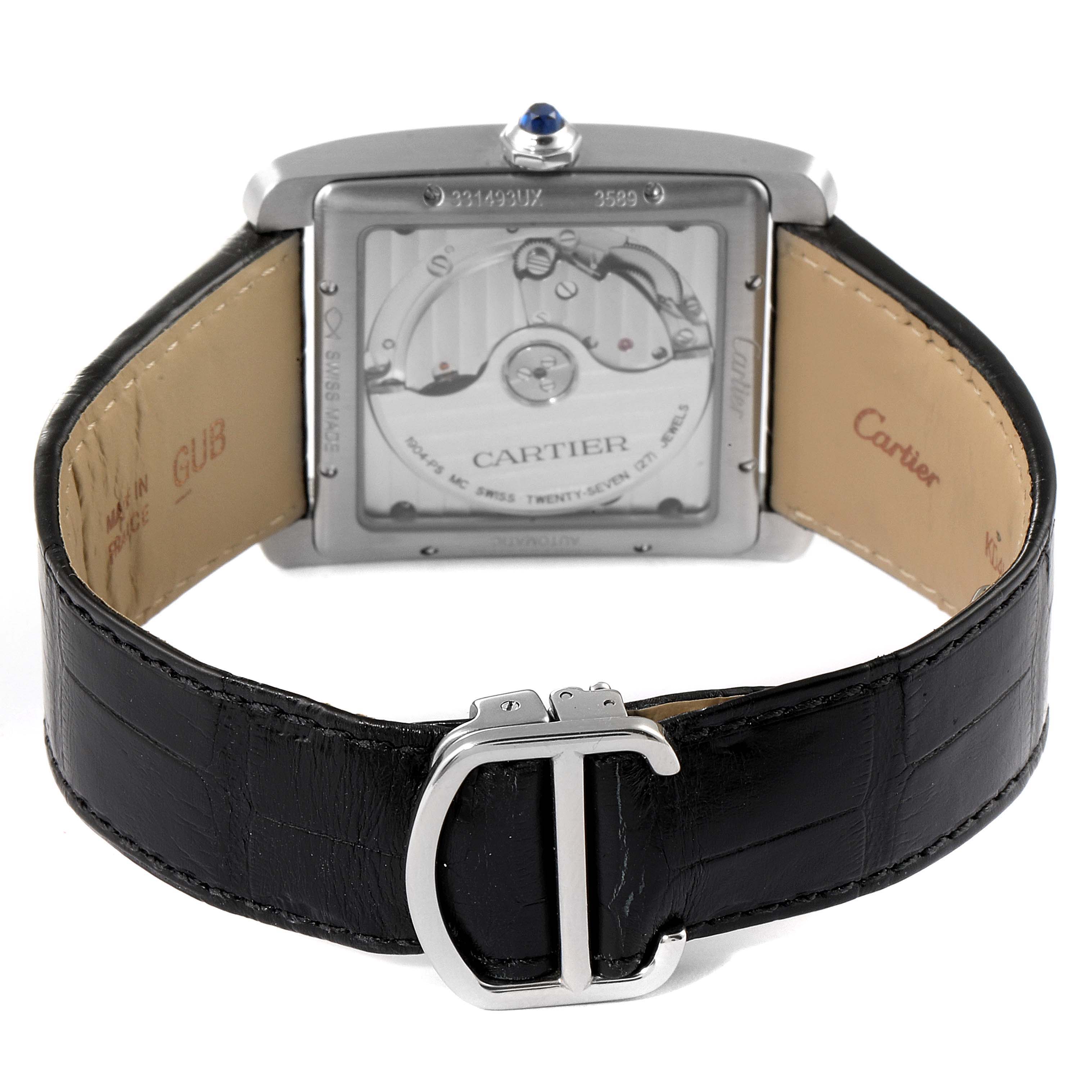 The image shows the back of a Cartier Tank MC W5330003 Men's Stainless Steel Silver Dial W5330003 Men's Stainless Steel Silver Dial watch, featuring its movement and black leather strap with a buckle.