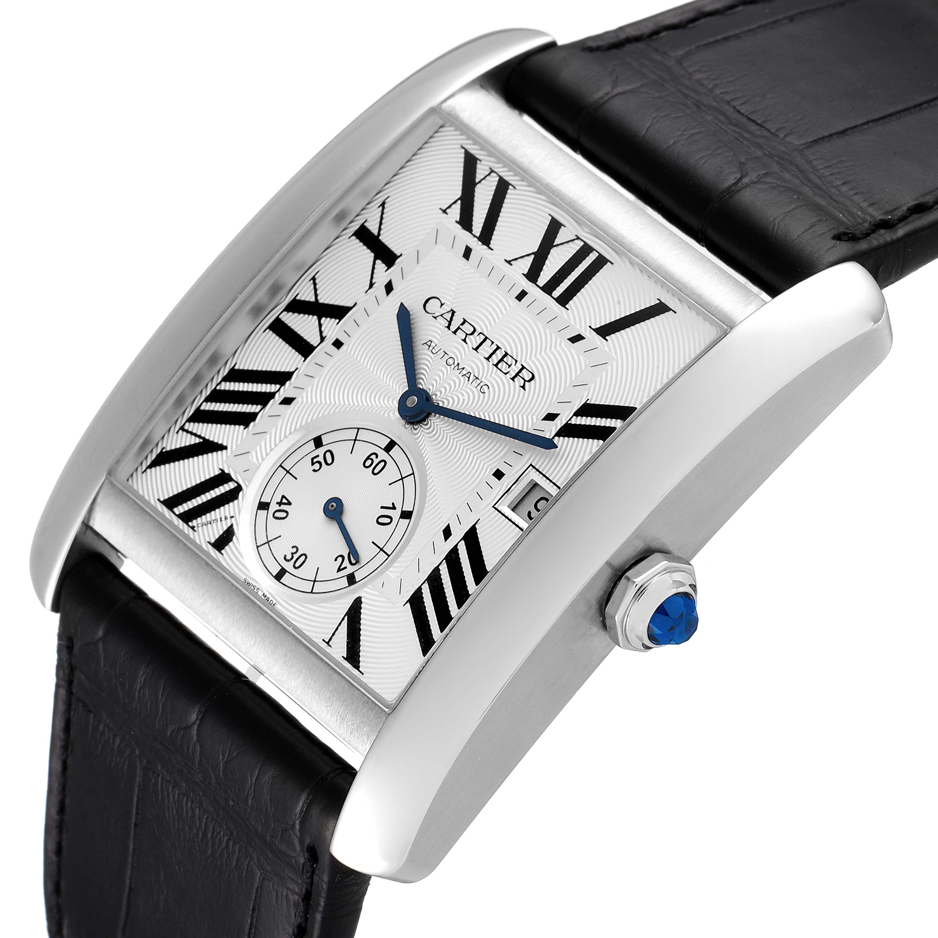The Cartier Tank MC W5330003 Men's Stainless Steel Silver Dial W5330003 Men's Stainless Steel Silver Dial watch is shown at a three-quarter angle, highlighting its case, dial, strap, and crown with a blue gemstone.