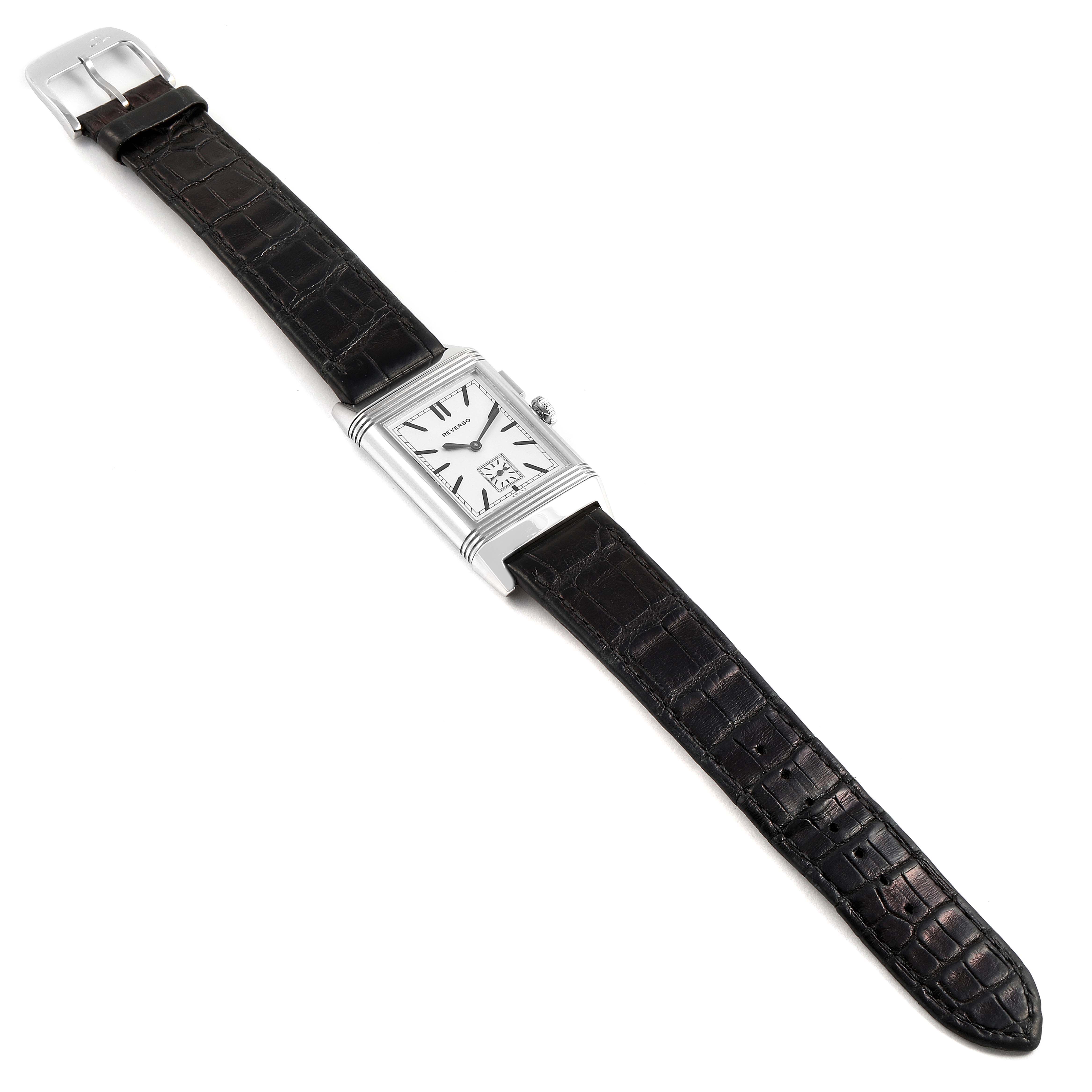The image shows a Jaeger-LeCoultre Reverso watch from the top view, including its rectangular face, case, and dark alligator leather strap.