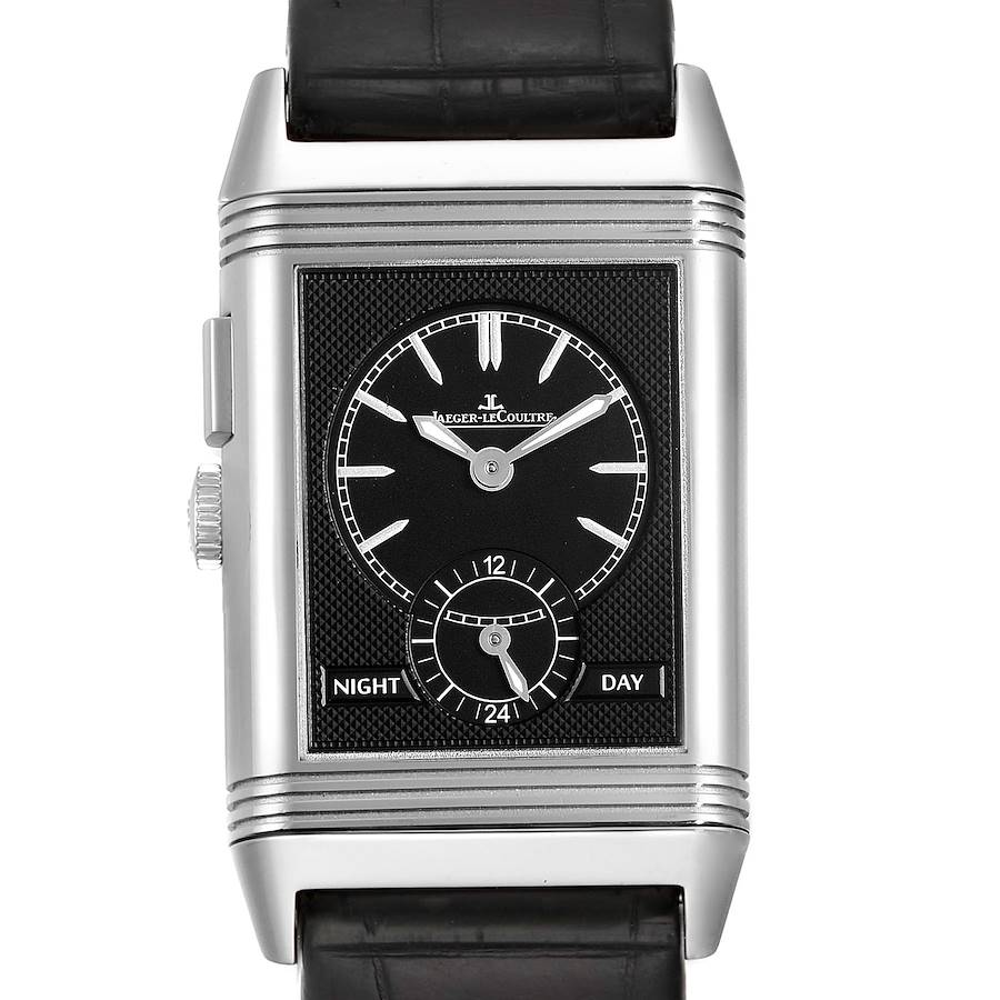 The image shows a front view of a Jaeger LeCoultre Reverso watch, highlighting its black dial, two sub-dials, and leather strap.