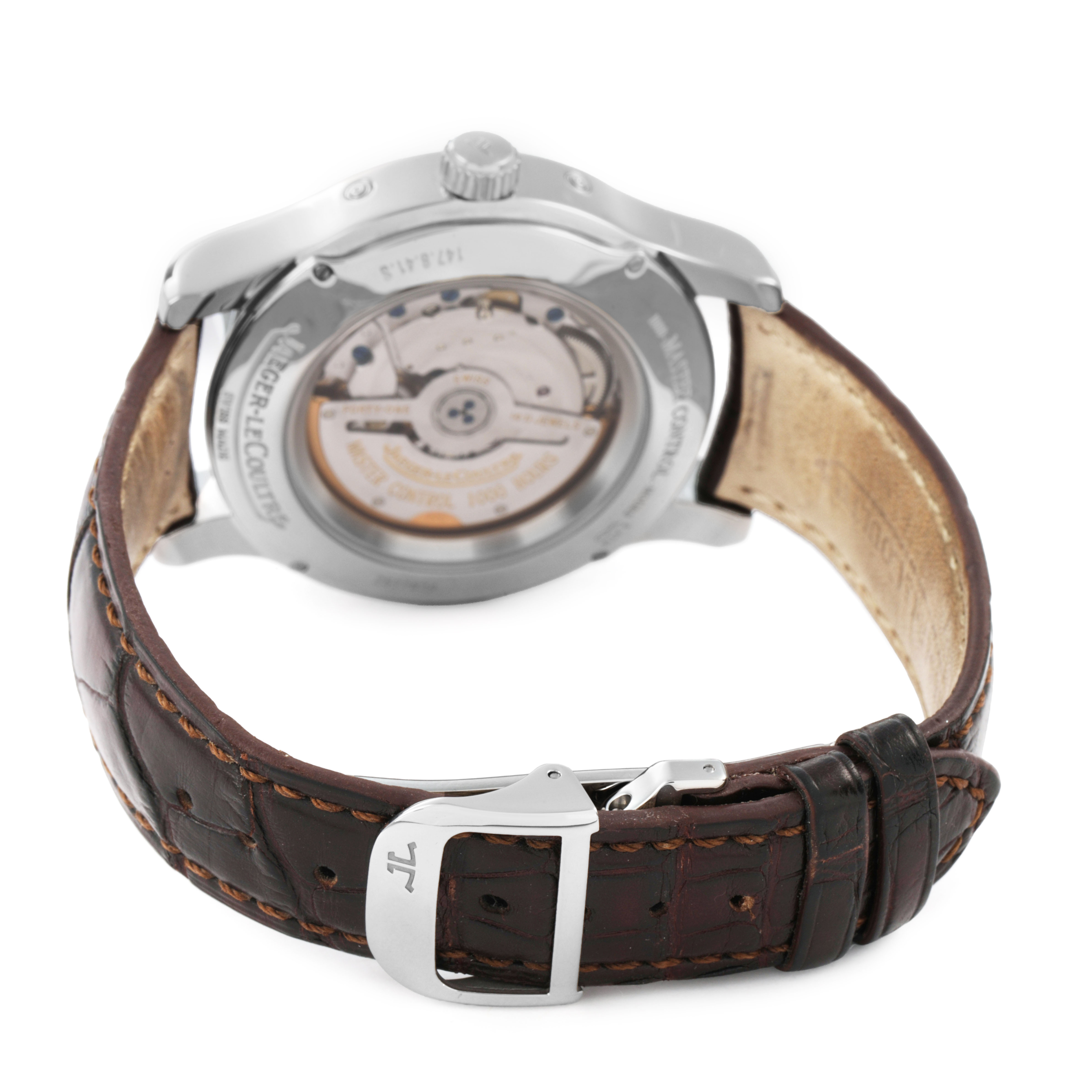 The image shows the back of a Jaeger-LeCoultre Master model watch, displaying the movement and brown leather strap.