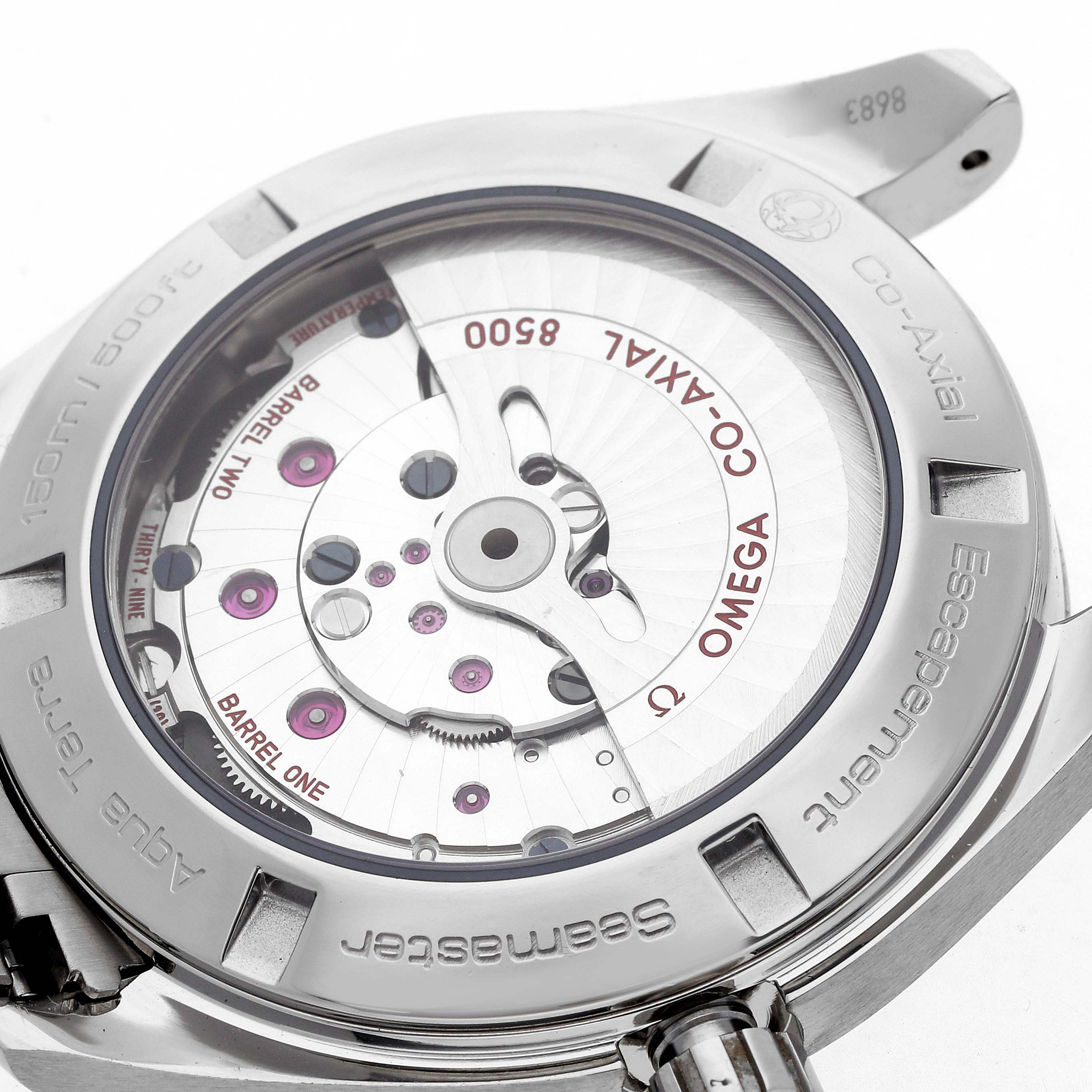 The image shows the back view of an Omega Aqua Terra 231.10.42.21.06.001 Men
s Stainless Steel Grey Dial watch, highlighting the Co-Axial movement components.