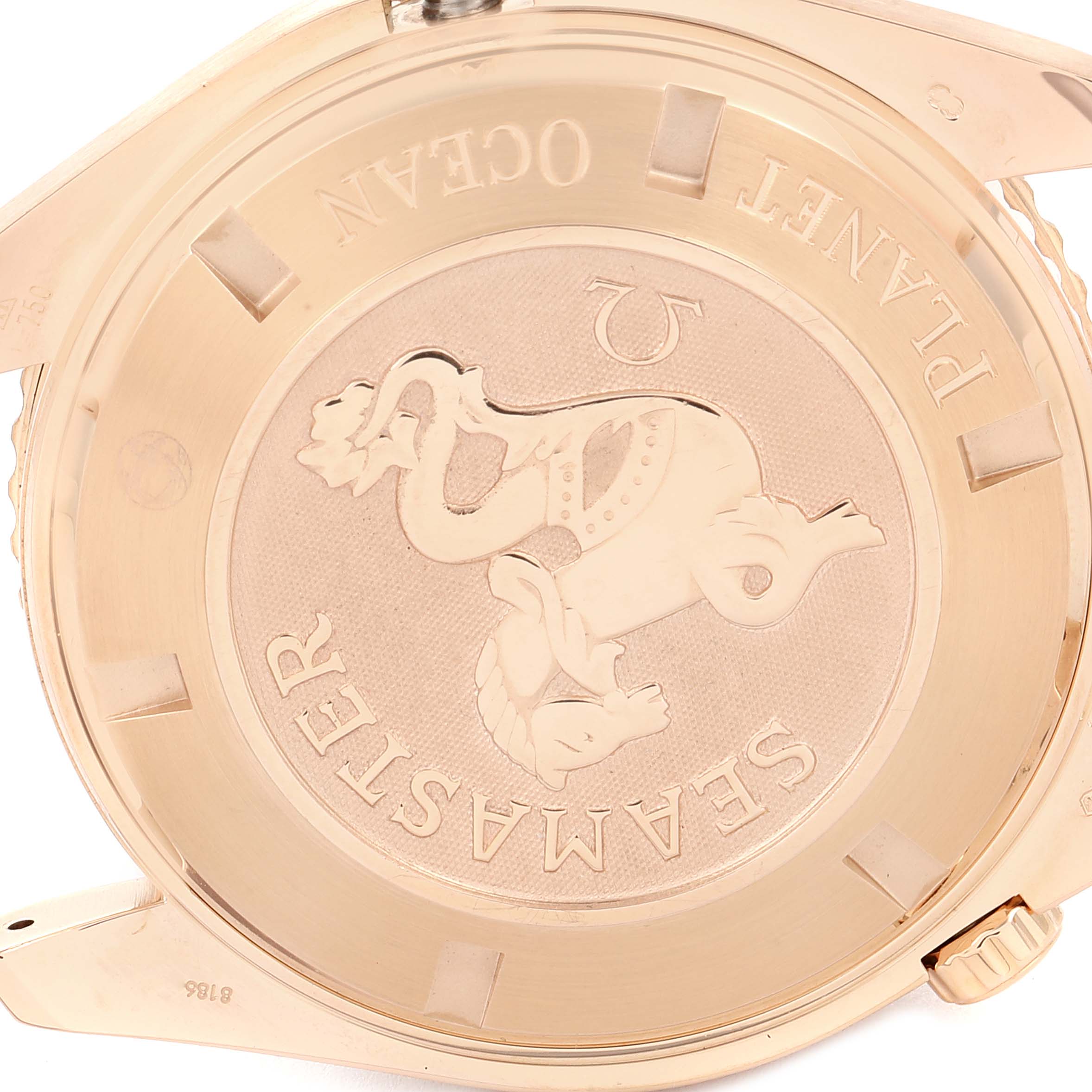 The image shows the case back of the Omega Planet Ocean 222.60.46.20.01.001 Men's Rose Gold Black Dial 222.60.46.20.01.001 Men's Rose Gold Black Dial watch, featuring its embossed logo and engravings.