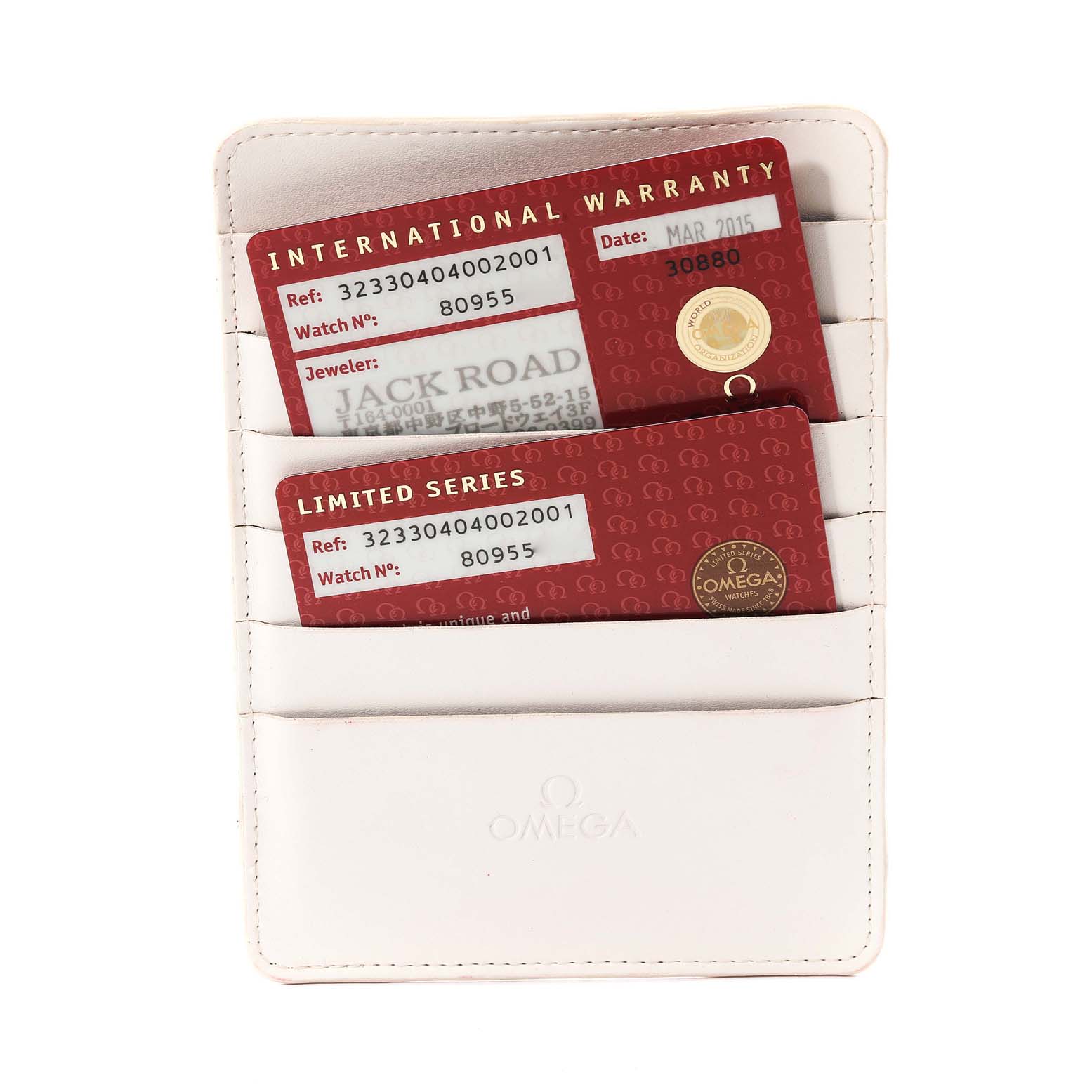 The image shows warranty cards and an authentication card for the Omega Speedmaster 323.30.40.40.02.001 Men's Stainless Steel White Dial 323.30.40.40.02.001 Men's Stainless Steel White Dial, held in a white Omega-branded cardholder.