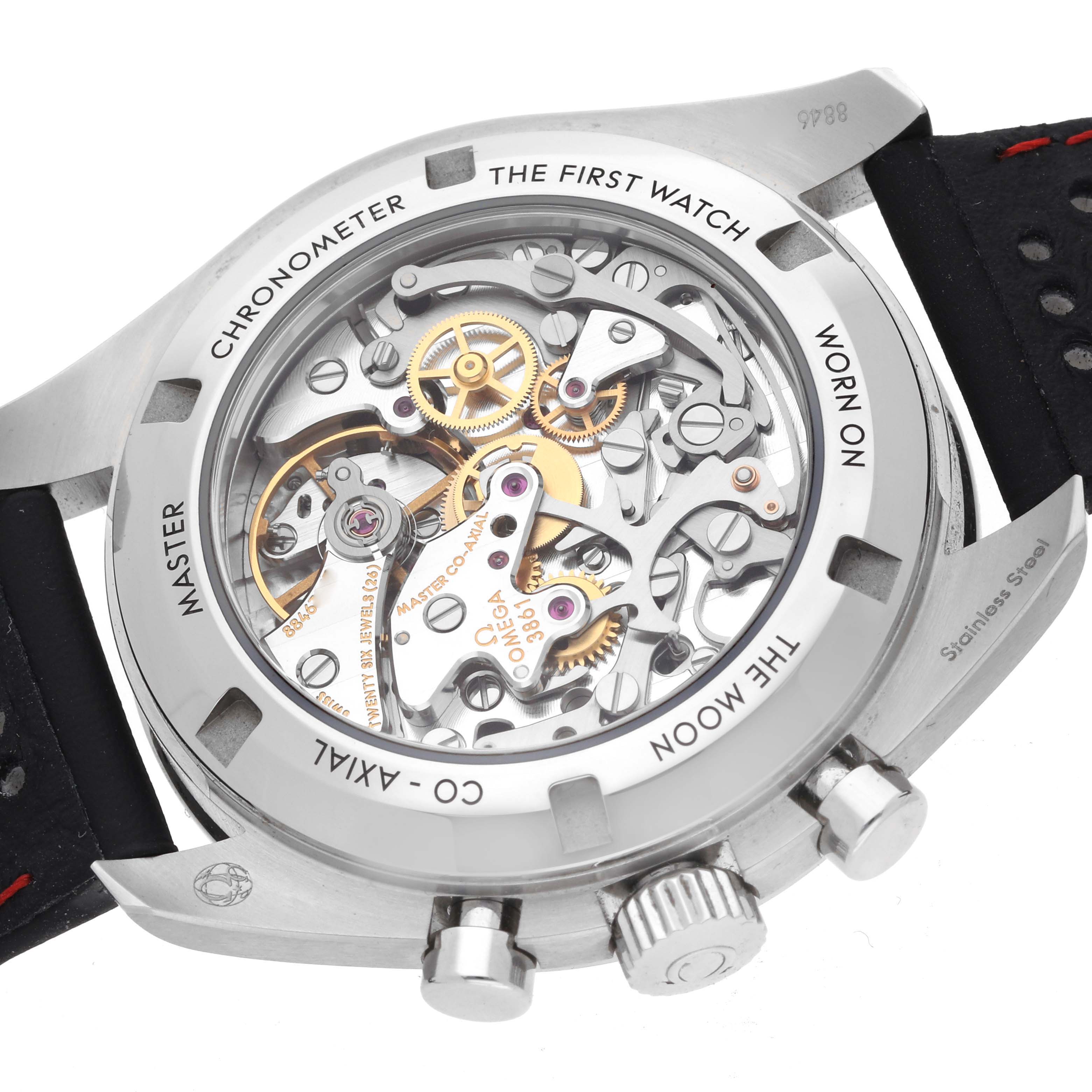 The image shows the back of the Omega Speedmaster 310.32.42.50.04.002 Men
s Stainless Steel White Dial, highlighting its movement and intricate gears.