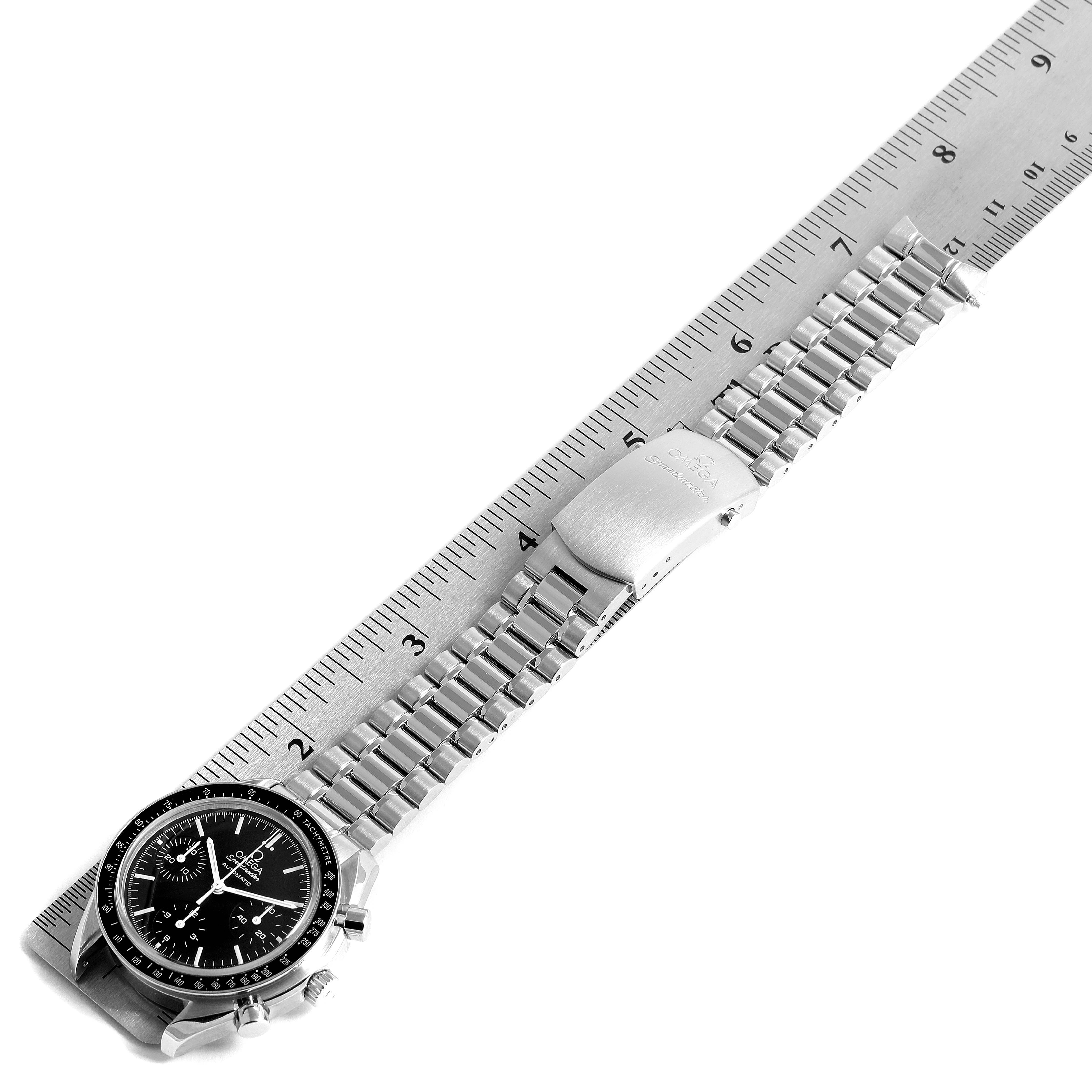 The image shows an Omega Speedmaster 3539.50.00 Men
s Stainless Steel Black Dial 3539.50.00 Men
s Stainless Steel Black Dial watch laid flat beside a ruler, highlighting the bracelet and clasp.