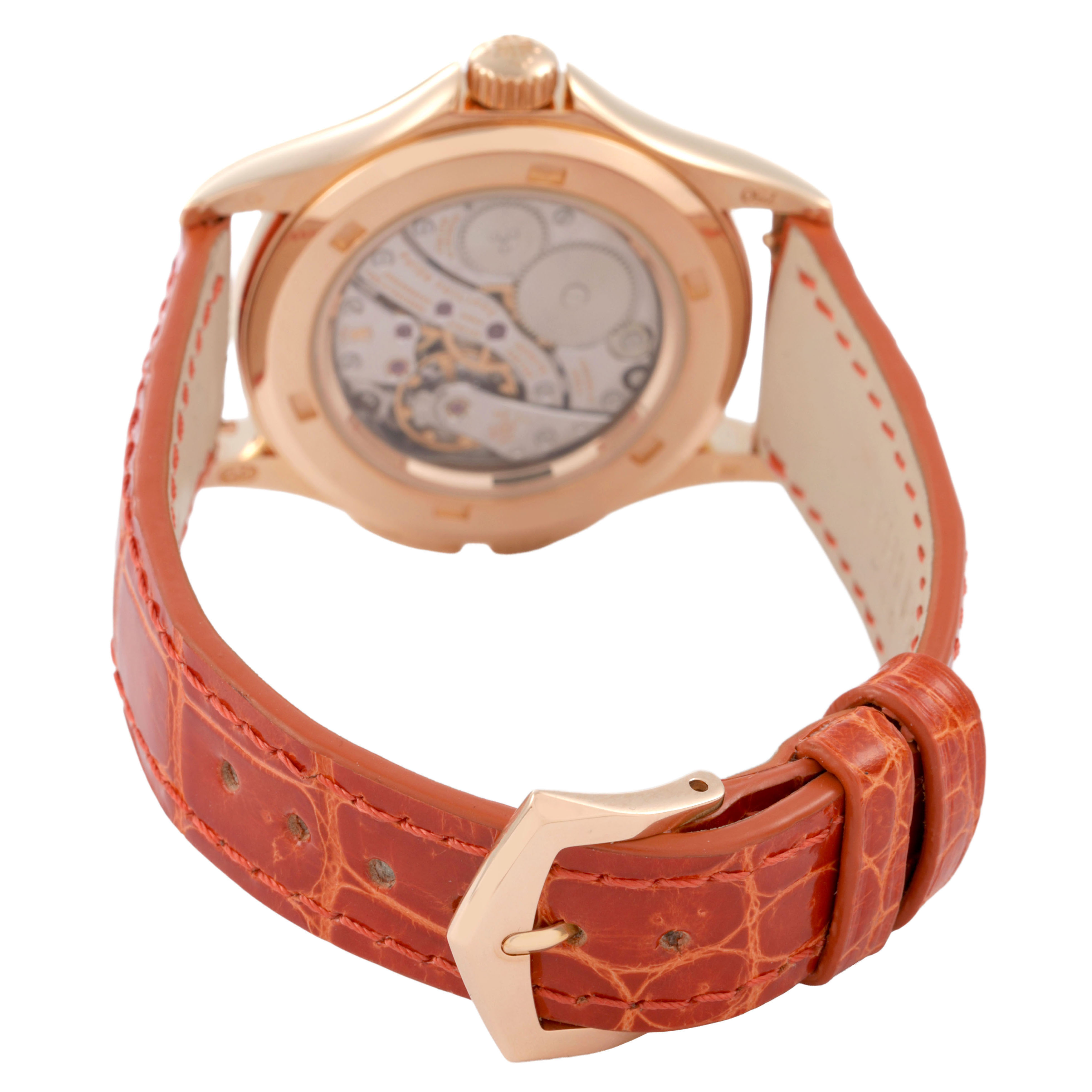The image shows the back of a Patek Philippe Calatrava 4934R-001 Women's Rose Gold Brown Dial watch, highlighting its movement and leather strap with a gold buckle.