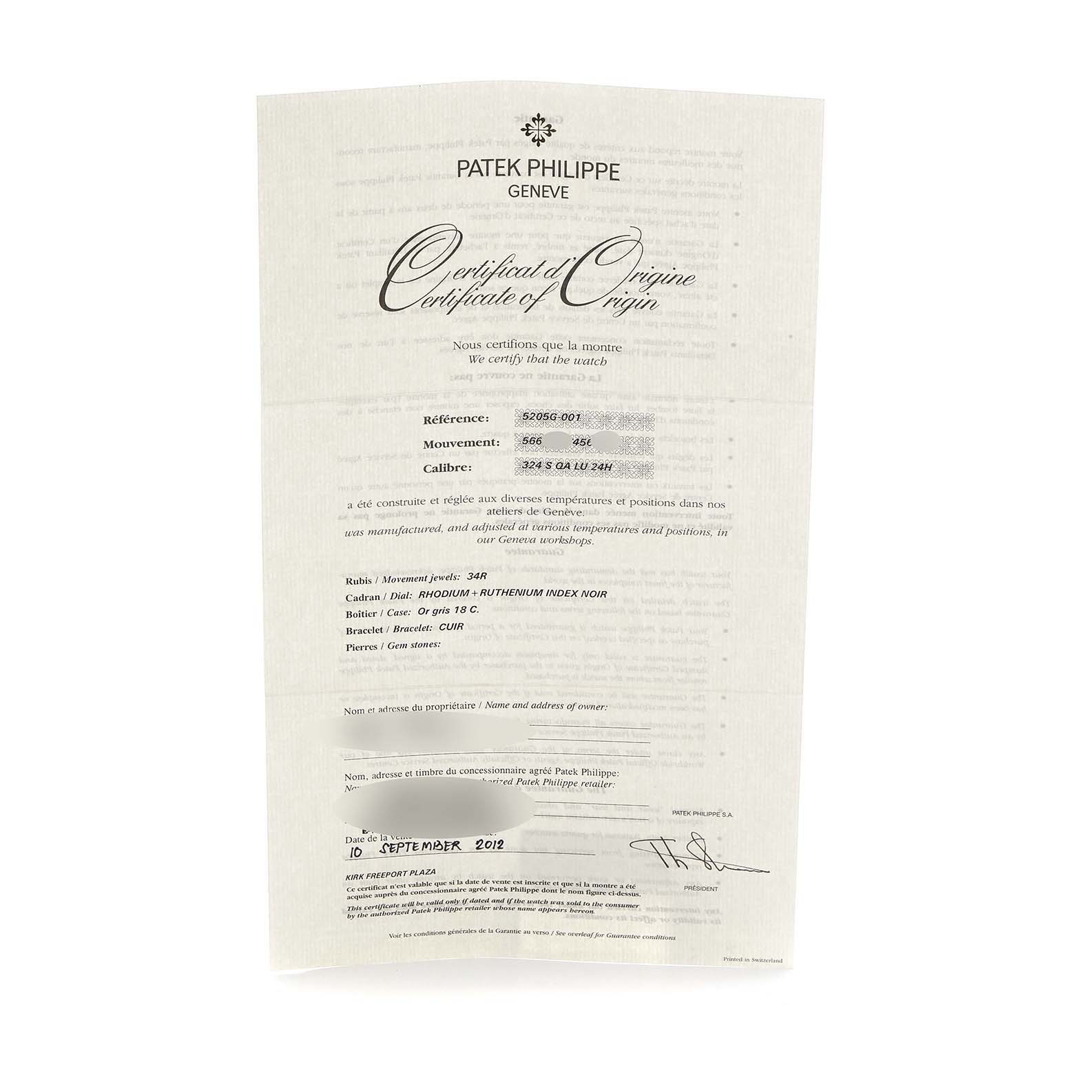 This image shows a Certificate of Origin for a Patek Philippe Complications 5205G Men
s White Gold Grey Dial model, featuring text details and specifications.