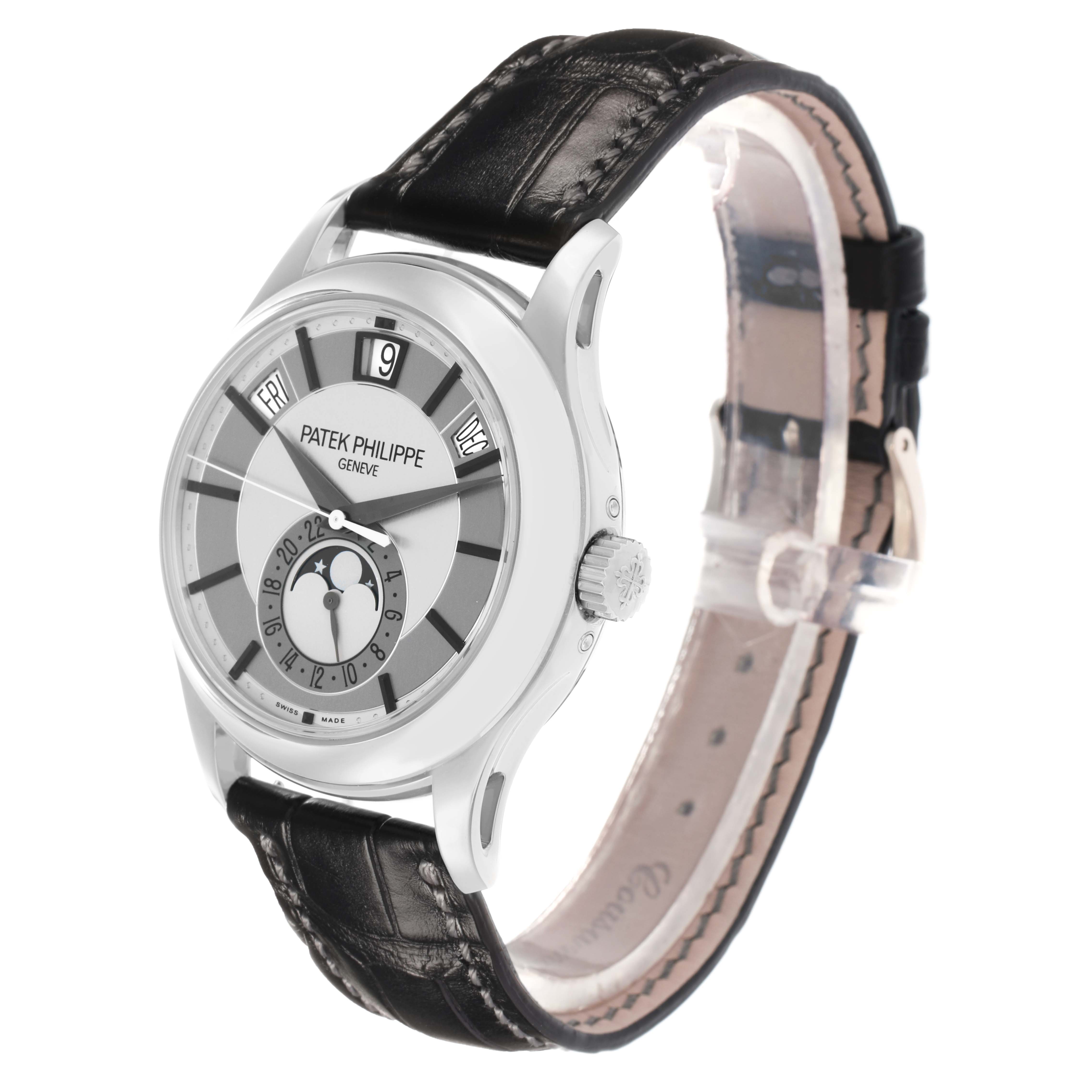 The image shows a Patek Philippe Complications 5205G Men
s White Gold Grey Dial watch at a slight side angle, highlighting the dial, crown, and leather strap.