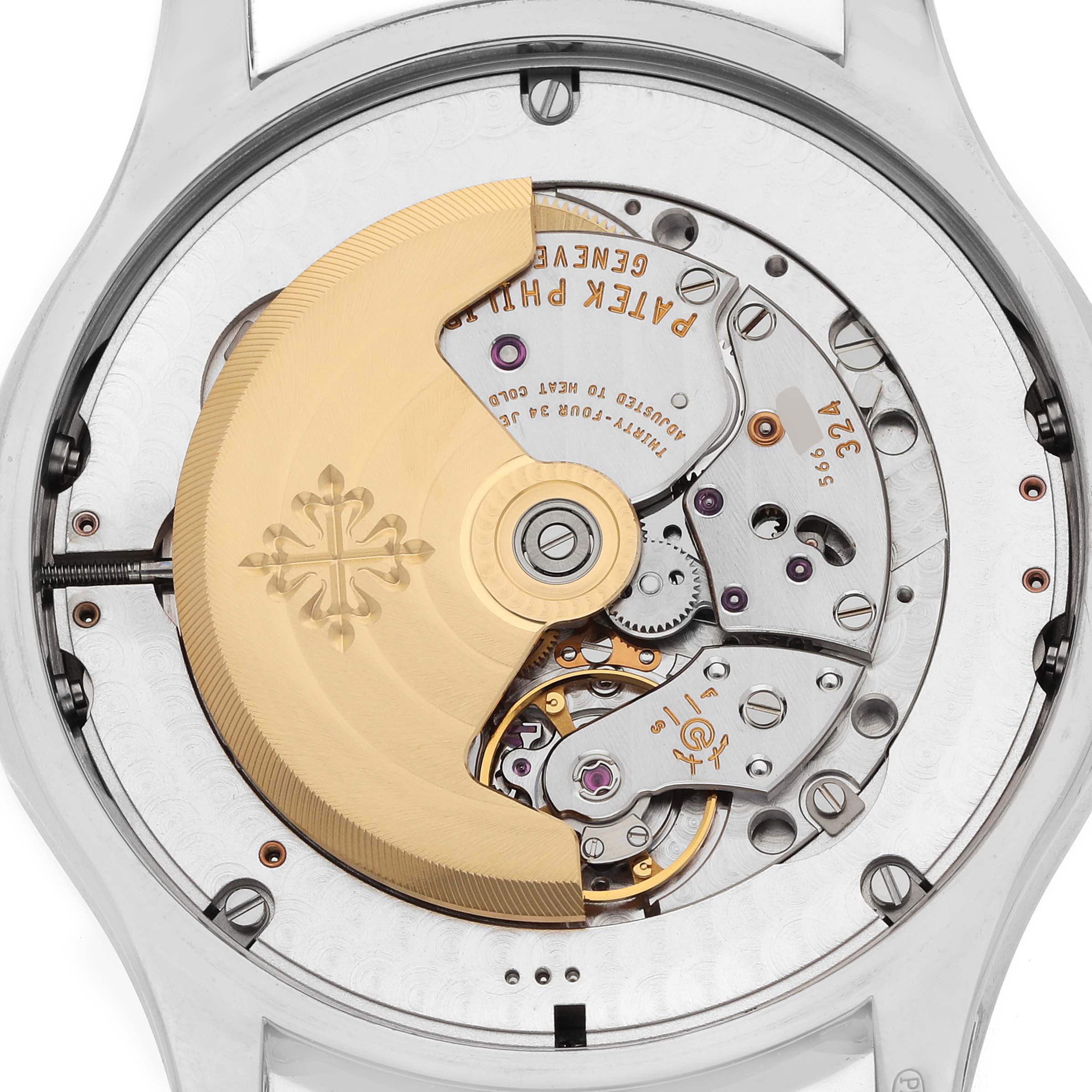 The Patek Philippe Complications 5205G Men
s White Gold Grey Dial model is shown from the back, highlighting the intricate movement and the gold rotor.