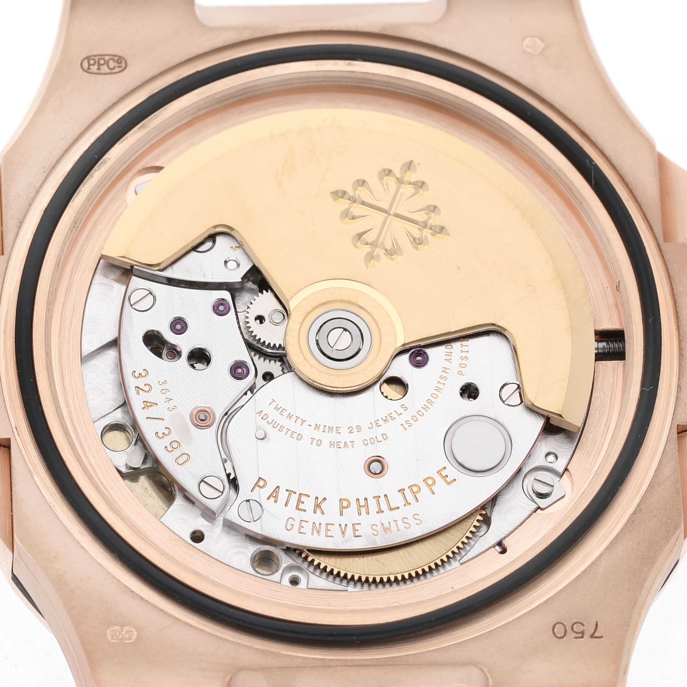 The image shows the movement of a Patek Philippe Nautilus 5711R-001 Men's Rose Gold Grey Dial watch viewed from the back, revealing its intricate mechanical parts.