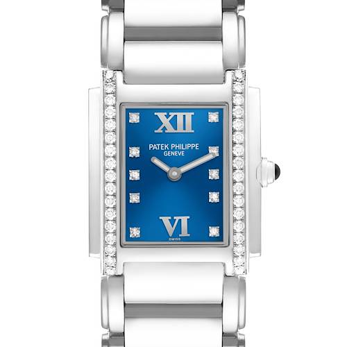 The Patek Philippe Twenty-4 4910A Women's Stainless Steel Blue Dial watch is shown from a frontal angle, highlighting its blue dial, diamond accents, and metal bracelet.