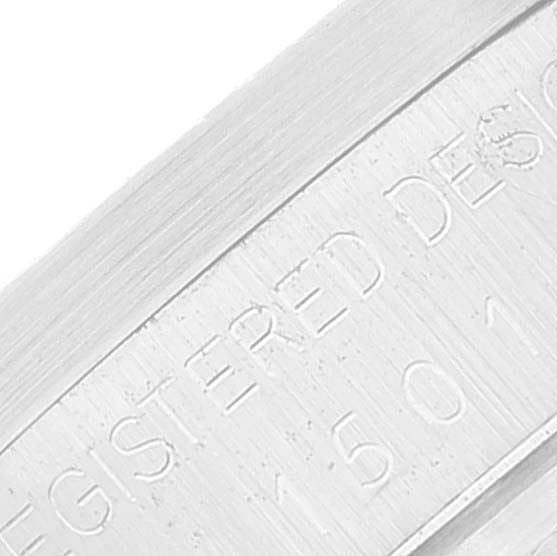 This image shows a close-up of the side of a Rolex Vintage Collection 15010 Men's Stainless Steel White Dial 15010 Men's Stainless Steel White Dial watch, displaying the engraved text.