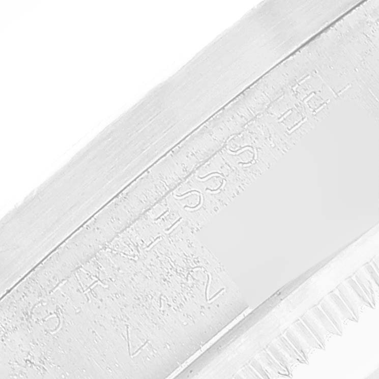 This is a close-up shot of the side engraving on a Rolex Vintage Collection 15010 Men's Stainless Steel White Dial 15010 Men's Stainless Steel White Dial watch, showing "STAINLESS."