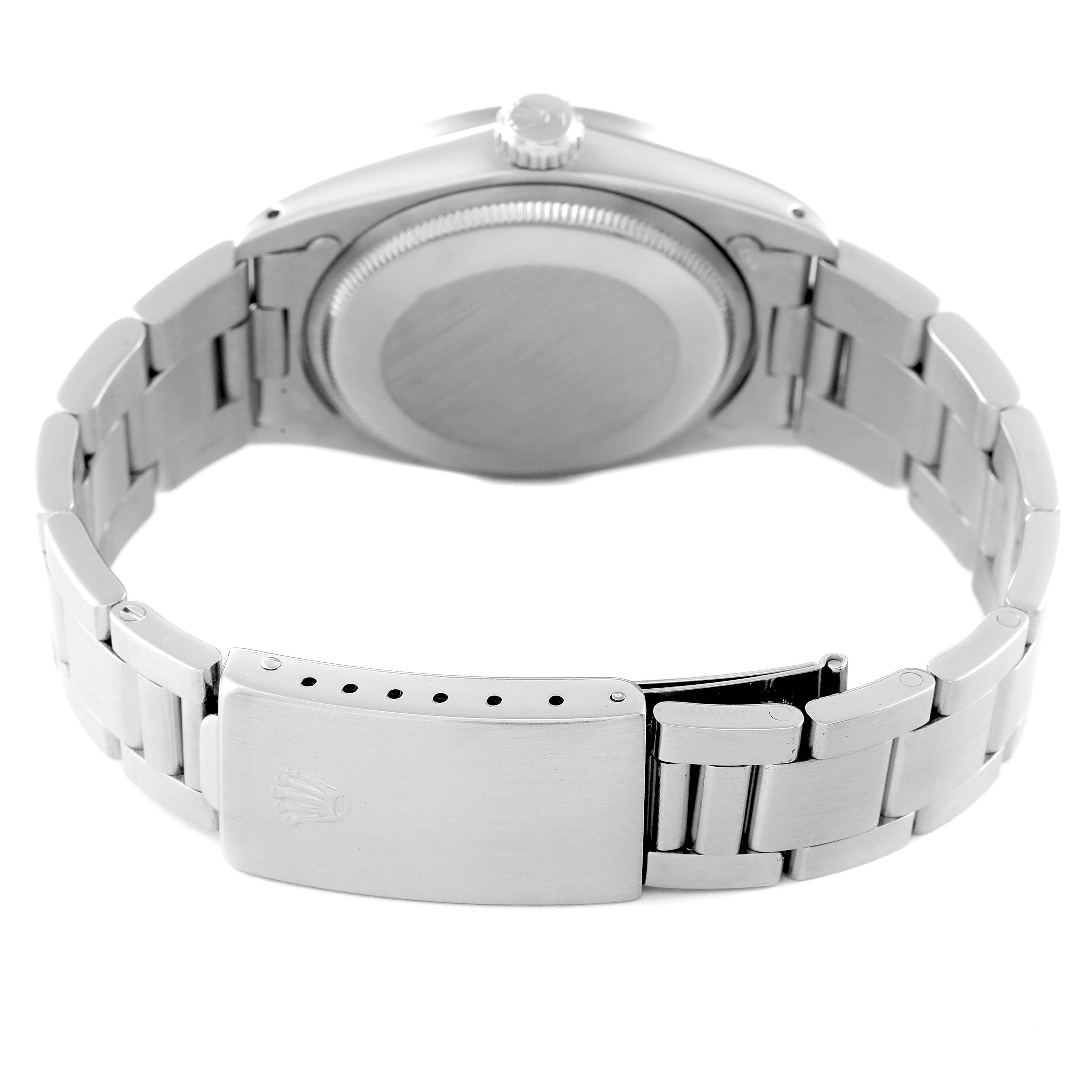 This image shows the back view of a Rolex Vintage Collection 15010 Men's Stainless Steel White Dial 15010 Men's Stainless Steel White Dial watch, highlighting the case back and the clasp of the metal bracelet.