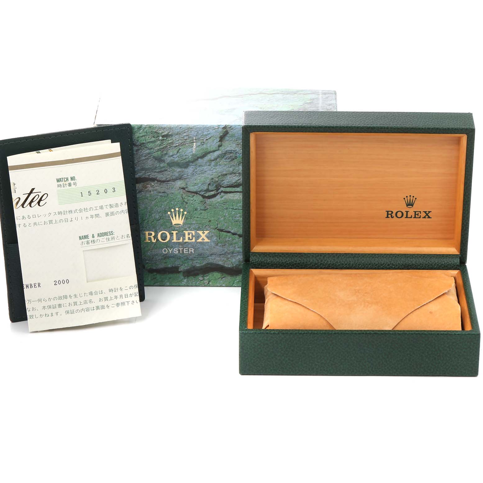 This image shows the open green box and warranty card for a Rolex Date 15203 Men's Steel and Gold (two tone) White Dial 15203 Men's Steel and Gold (two tone) White Dial model watch.