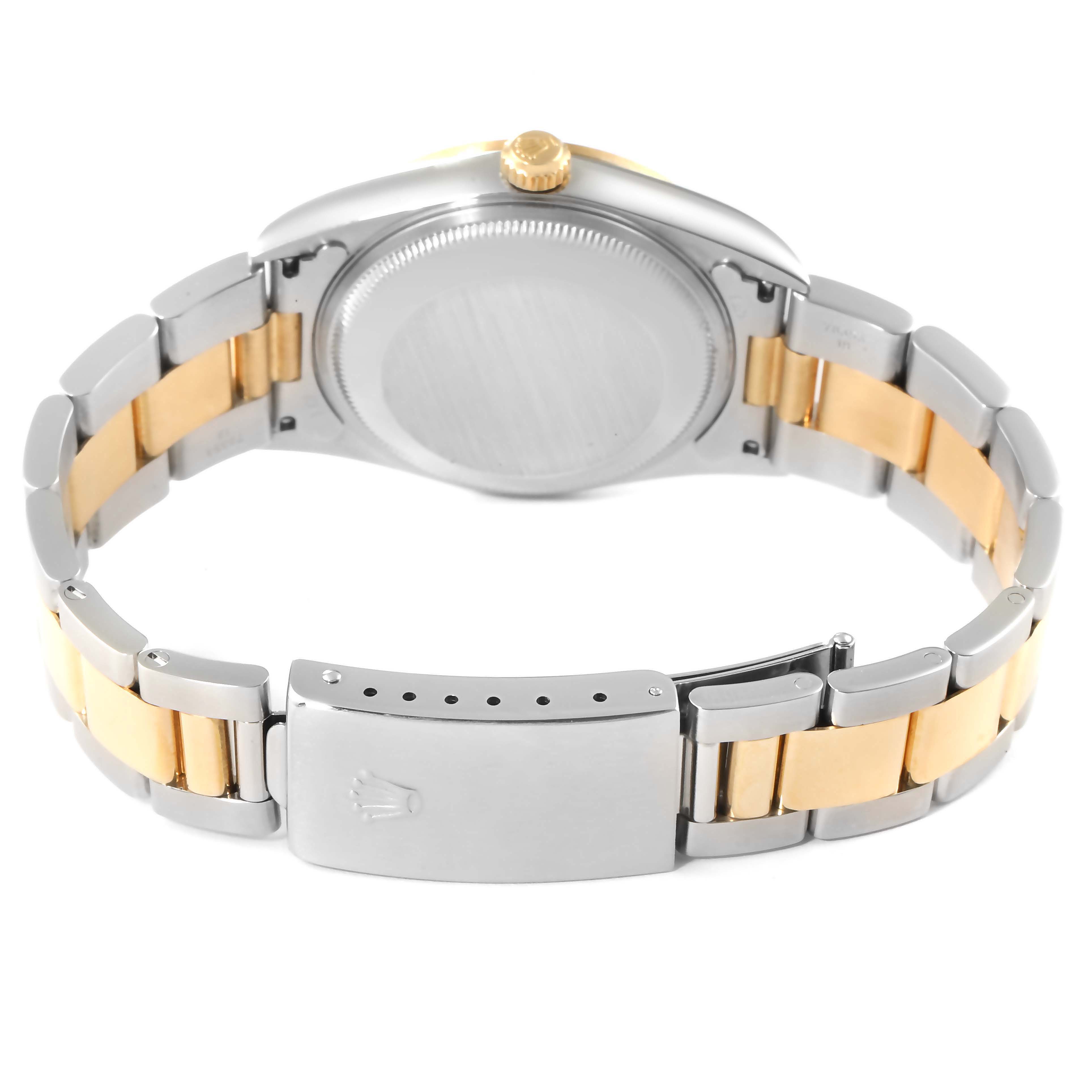 The image shows the back view of a Rolex Date 15203 Men's Steel and Gold (two tone) White Dial 15203 Men's Steel and Gold (two tone) White Dial model, highlighting its case back and two-tone bracelet with a clasp.