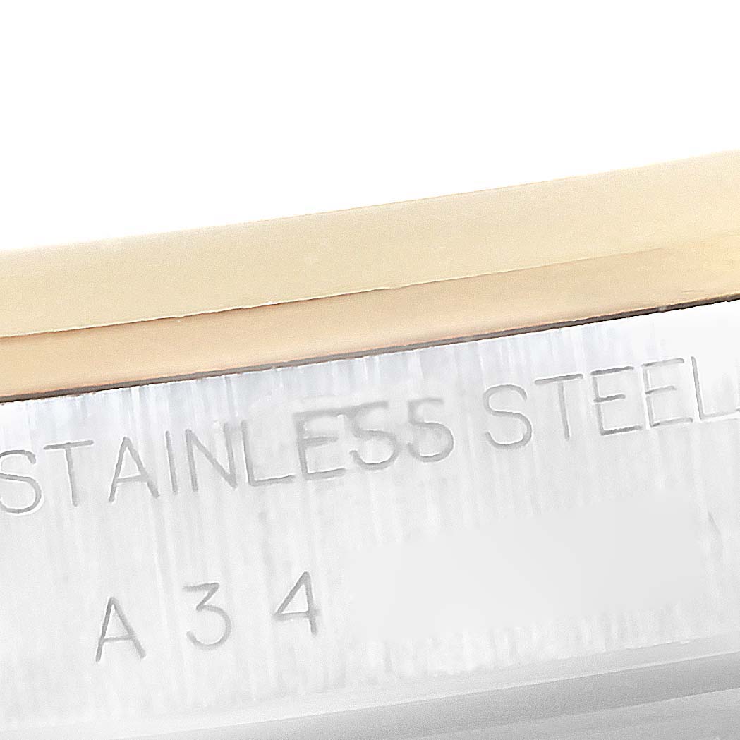 The image shows a close-up of the stainless steel casing of a Rolex Date 15203 Men's Steel and Gold (two tone) White Dial 15203 Men's Steel and Gold (two tone) White Dial model watch, with engraving details visible.