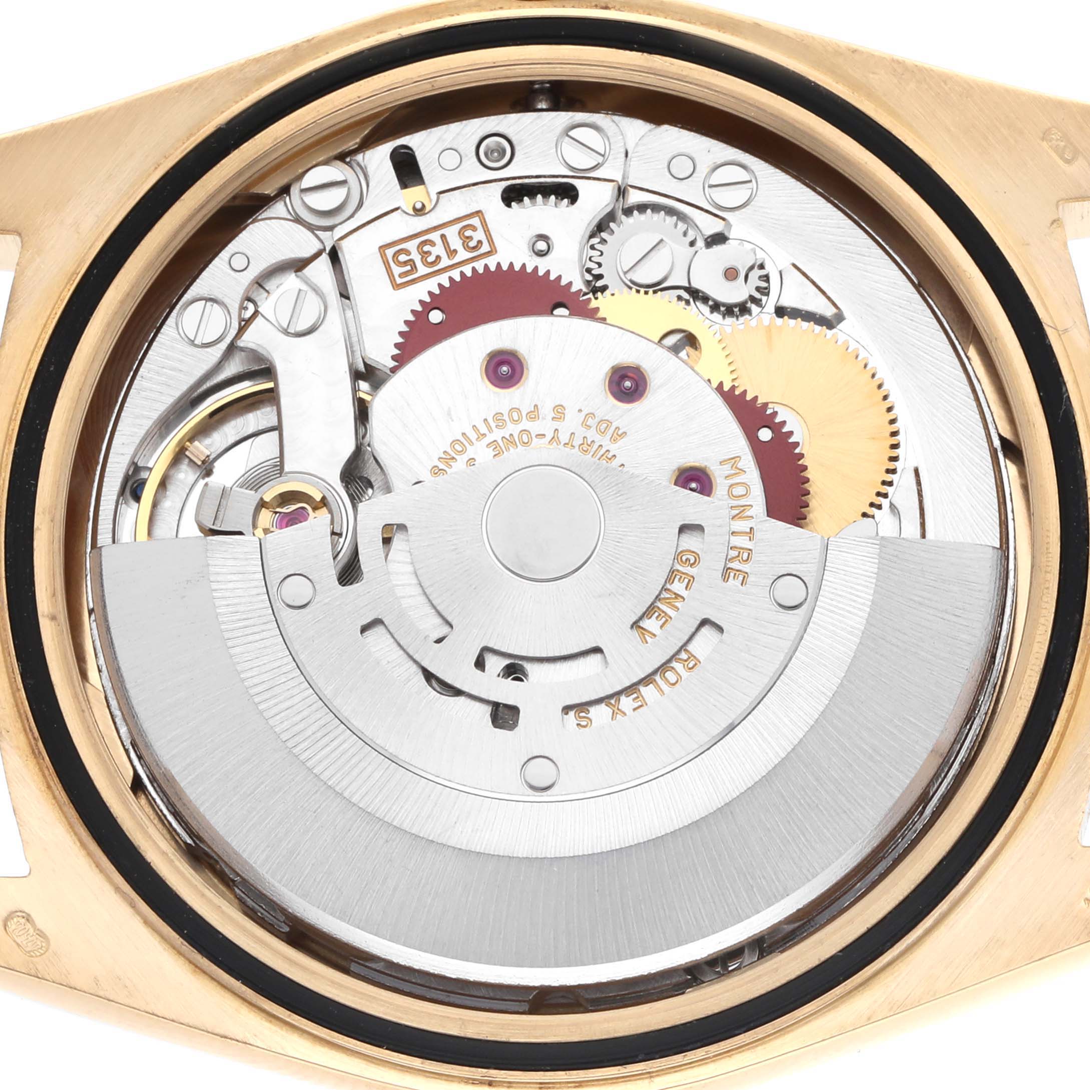 The image shows a close-up of the movement inside a Rolex Datejust 16238 Men
s Yellow Gold Champagne Dial, highlighting gears and the rotor.