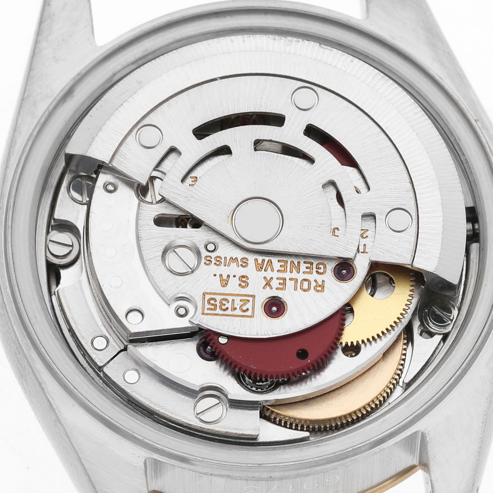 The image shows the movement of a Rolex Datejust 69173 Women's Steel and Gold (two tone) Champagne Dial watch from a back view, highlighting gears and inscriptions.