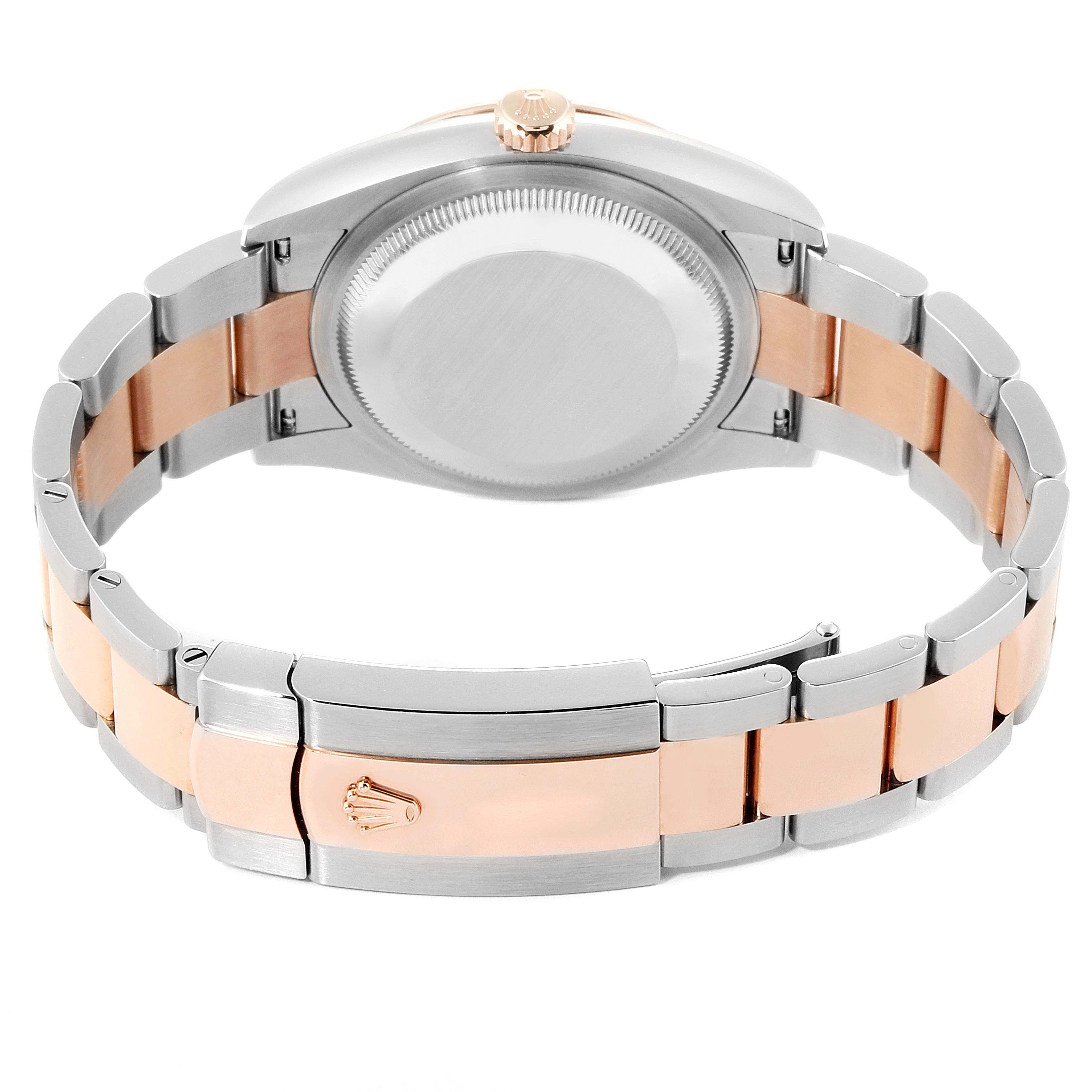 This image shows the back view of a Rolex Datejust 126231 Men's Stainless Steel White Dial 126231 Men's Stainless Steel White Dial, revealing its case back, crown, and two-tone metal bracelet.