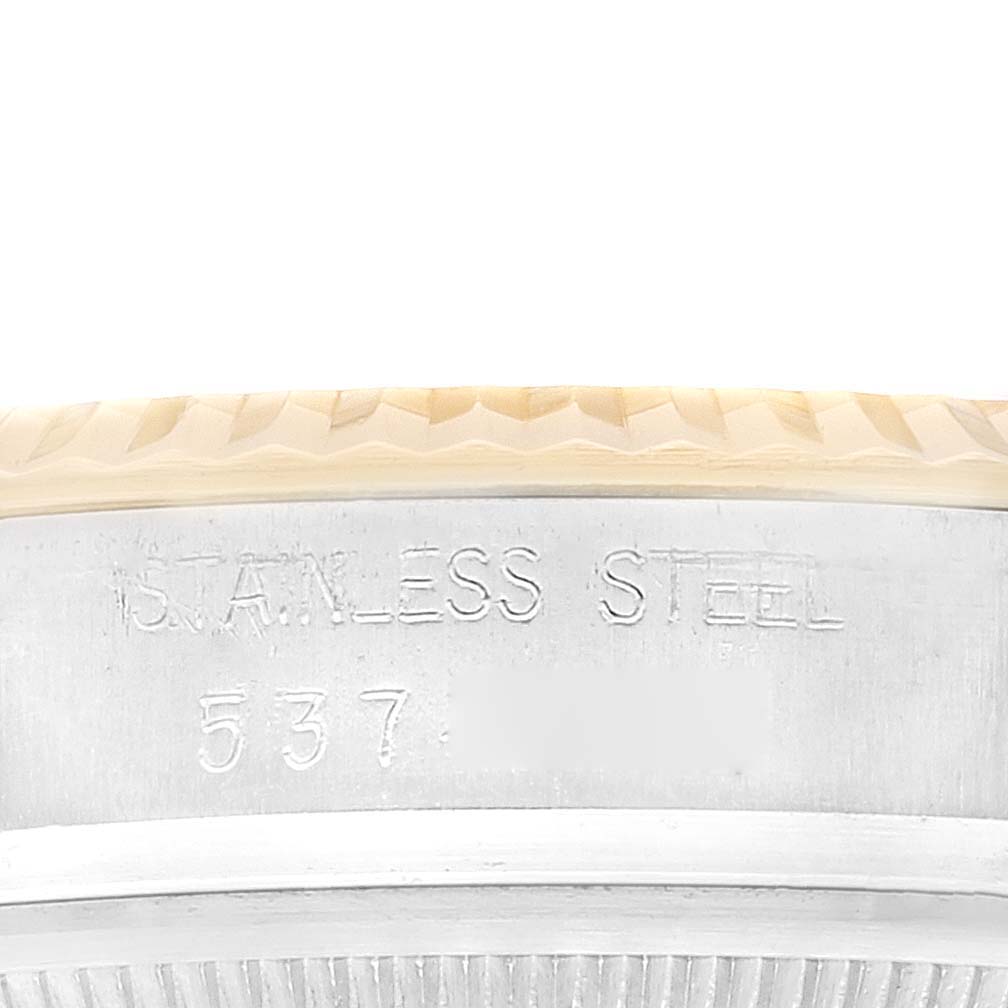 The image shows a close-up view of the case back with "STAINLESS STEEL" engraving on the Rolex Vintage Collection 16013 Men
s Steel and Gold (two tone) Champagne Dial 16013 Men
s Steel and Gold (two tone) Champagne Dial watch.