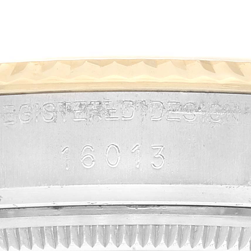 This image shows a close-up of the side of the bezel and case with the model number (16013) of a Vintage Collection Rolex watch.