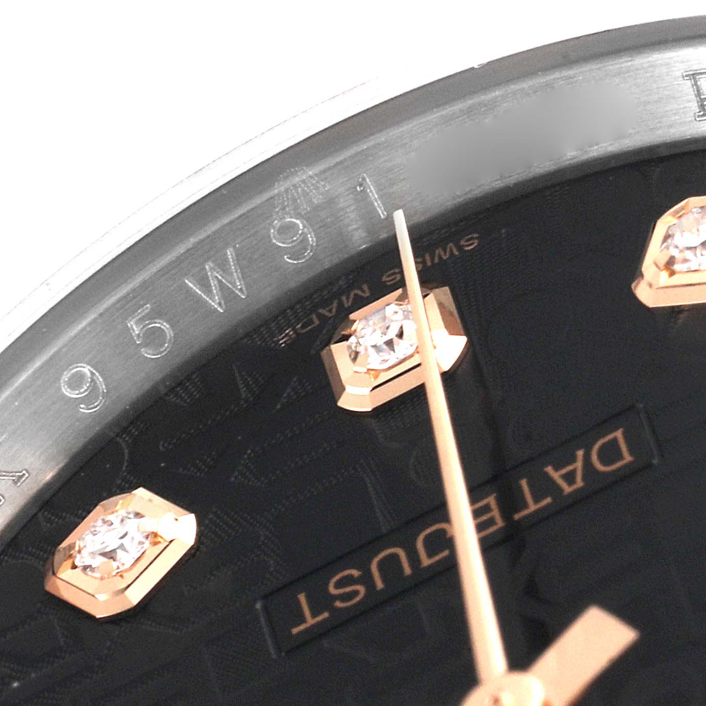 The image shows a close-up of the dial and bezel, focusing on the "Datejust" label and details of the Datejust model by Rolex.