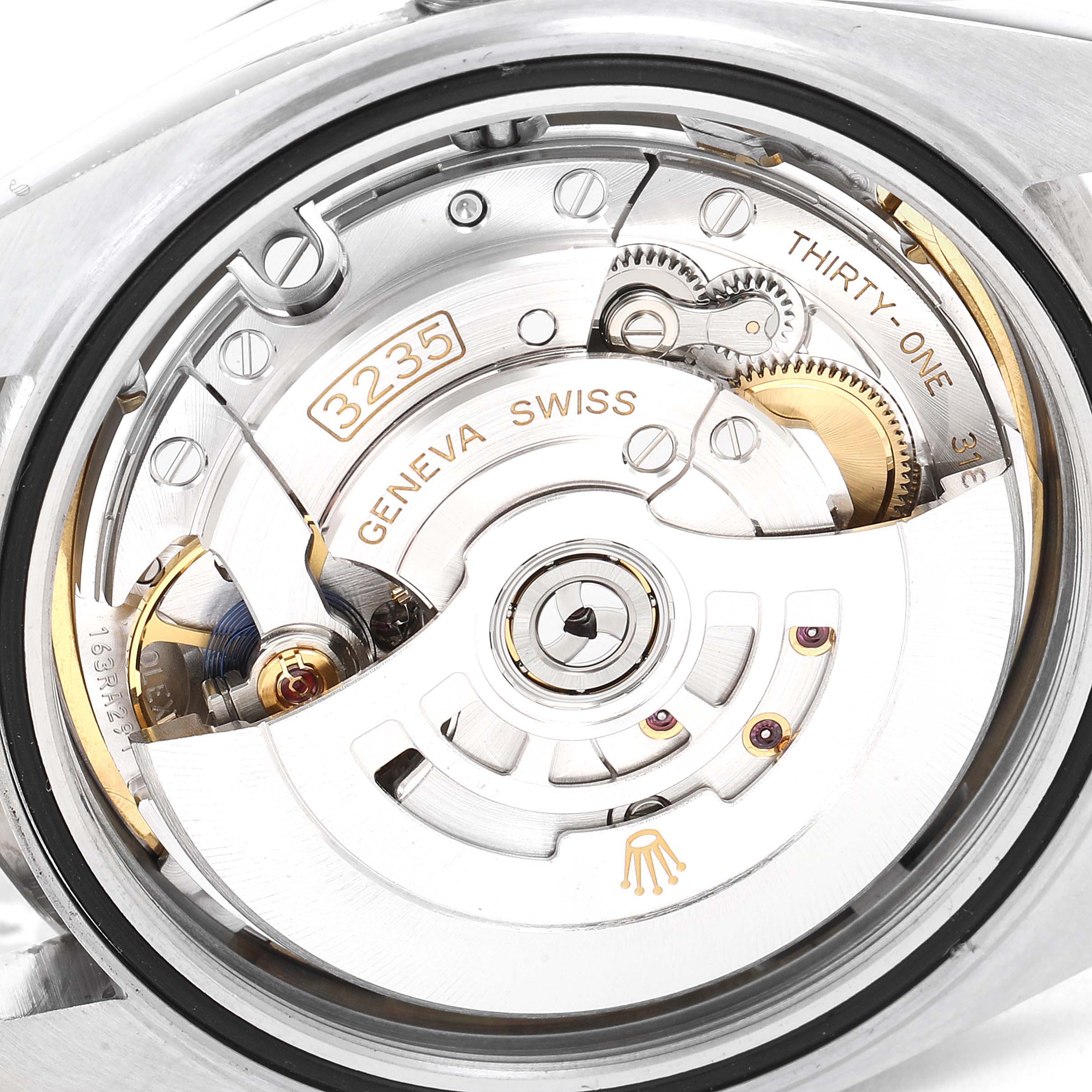 The image shows the intricate internal mechanism of a Rolex Datejust 41 126334 Men
s Stainless Steel Blue Dial 126334 Men
s Stainless Steel Blue Dial watch, viewed from the back.