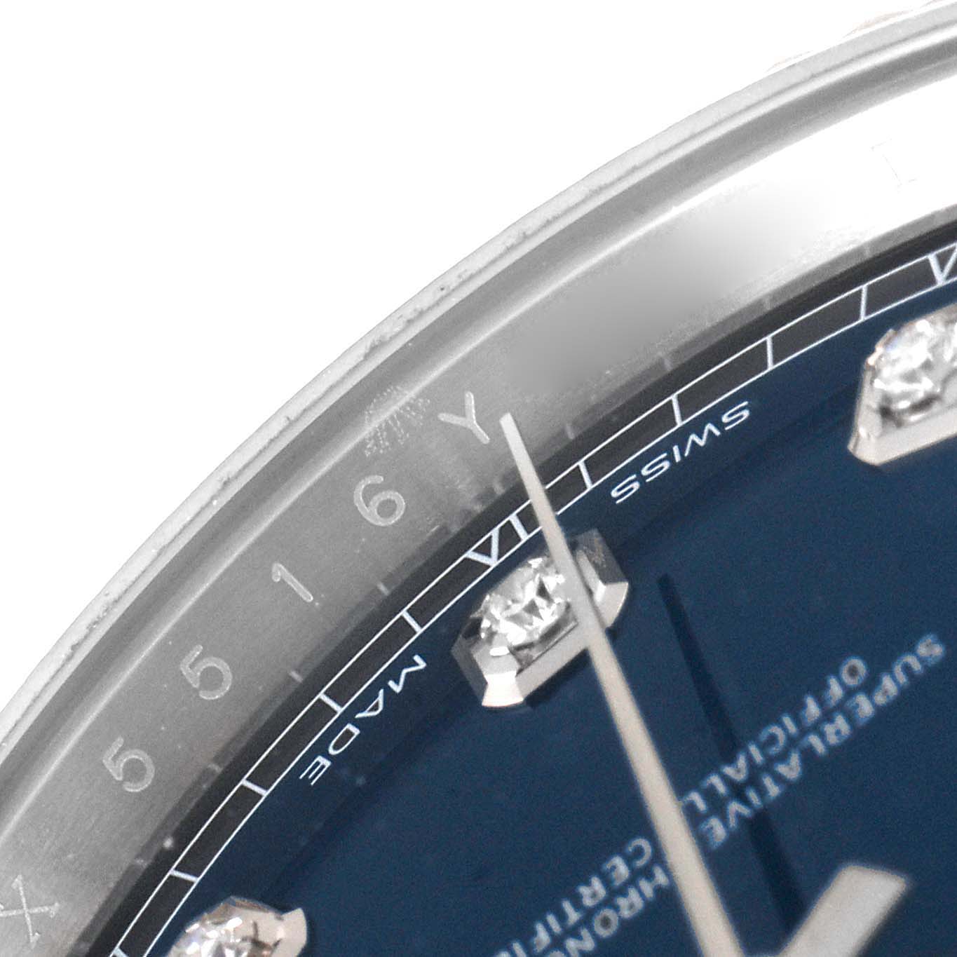 This image shows a close-up angle of the Rolex Datejust 41 126334 Men
s Stainless Steel Blue Dial 126334 Men
s Stainless Steel Blue Dial watch, focusing on the bezel, part of the blue dial, and hour markers.