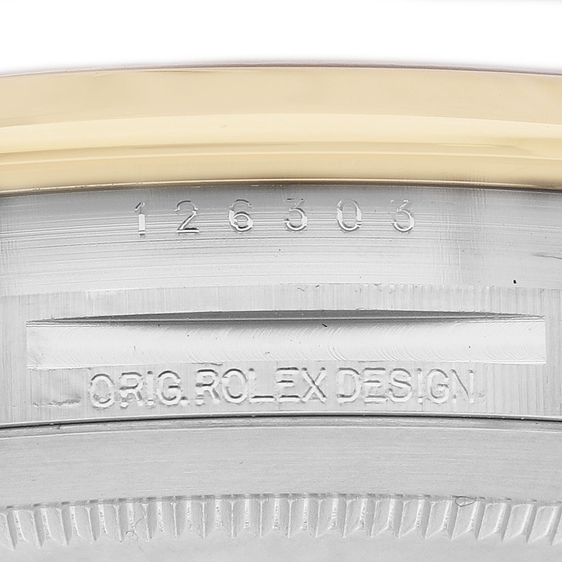 The image shows the engraved reference number and "ORIG. ROLEX DESIGN" on the case side of the Rolex Datejust 126303 Men's Steel and Gold (two tone) Black Dial.