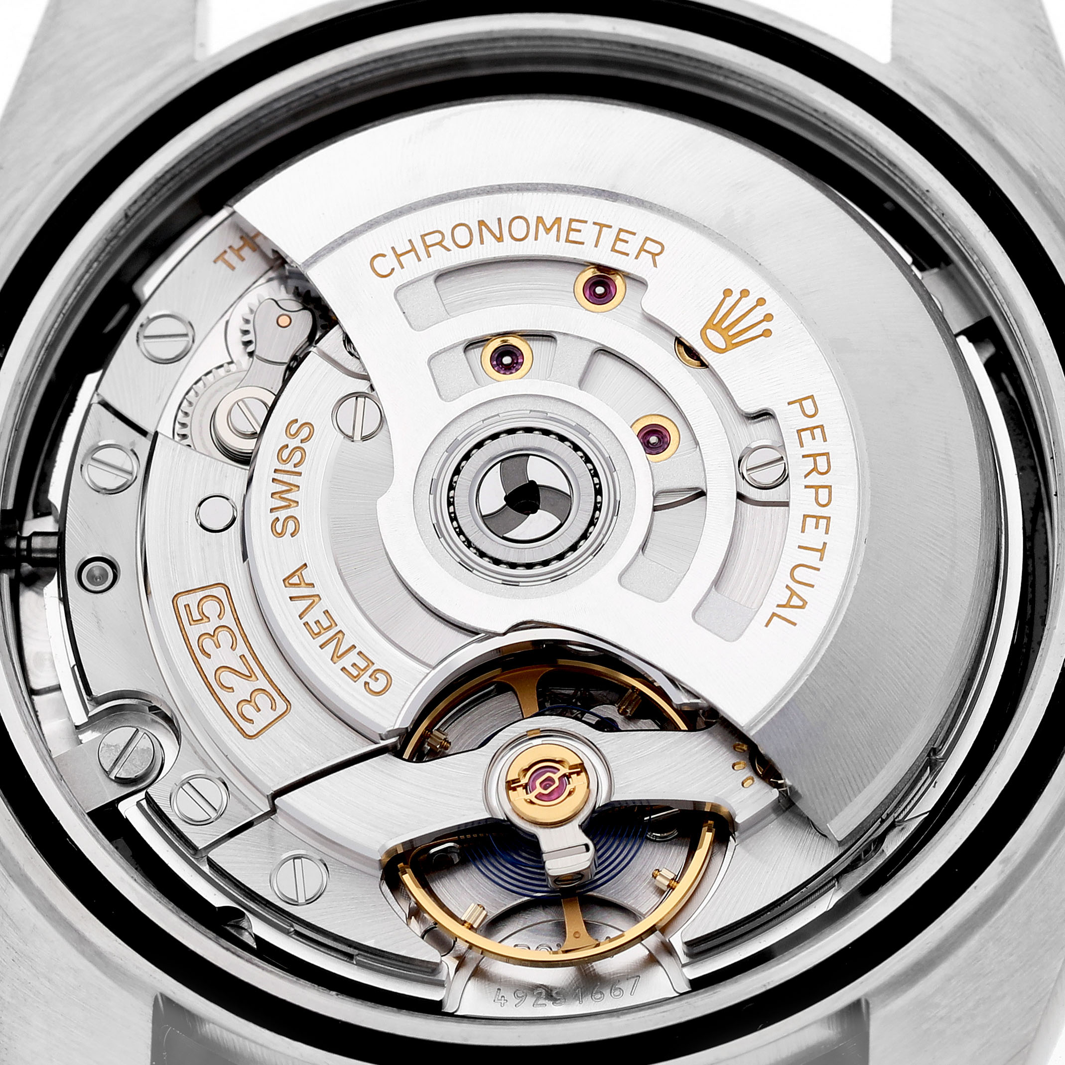 The image shows the movement of the Rolex Datejust 126303 Men's Steel and Gold (two tone) Black Dial, focusing on the intricate internal mechanism from a top-down view.