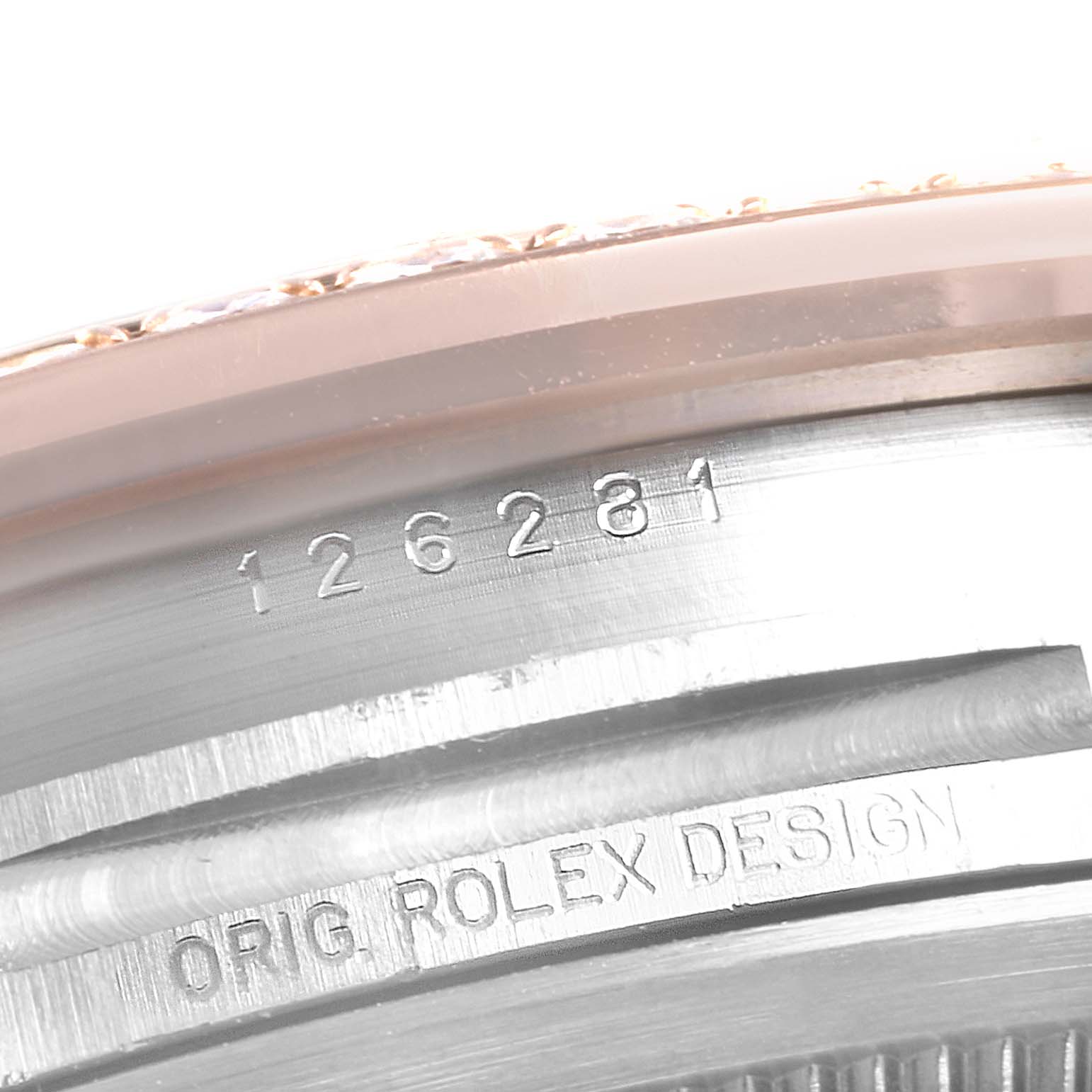 This image shows the engraved serial number on the case-back of a Rolex Datejust 126281 Men's Rose Gold Black Dial 126281 Men's Rose Gold Black Dial watch.