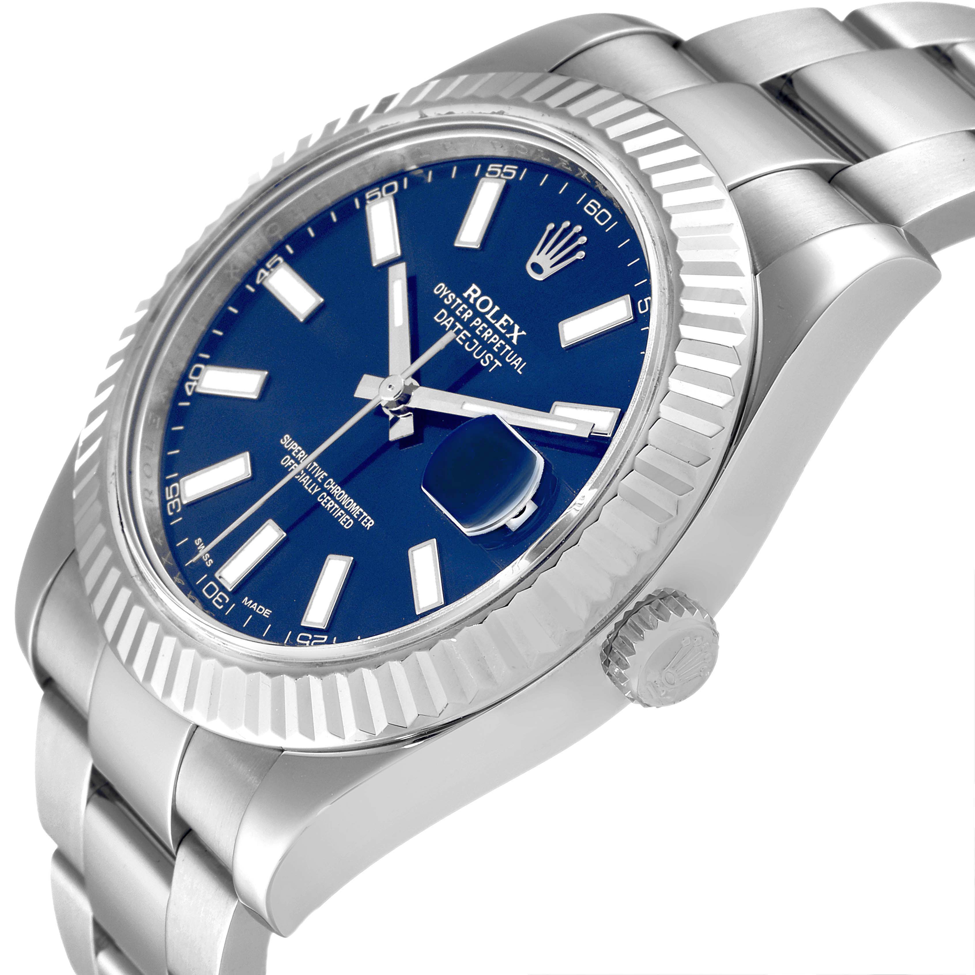 The Rolex Datejust 41 116334 Men
s Stainless Steel Blue Dial is shown in a side angle, highlighting the blue dial, fluted bezel, crown, and part of the bracelet.