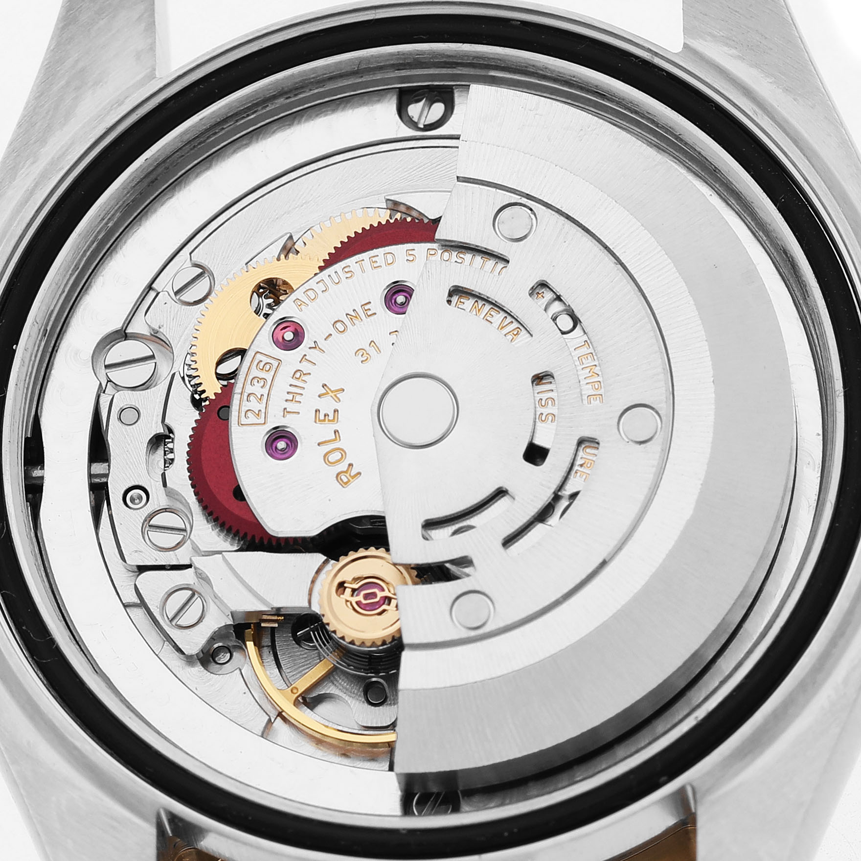 The image shows the intricate movement mechanism of a Rolex Datejust 278273 Women's Steel and Gold (two tone) White Dial watch, viewed from the back.