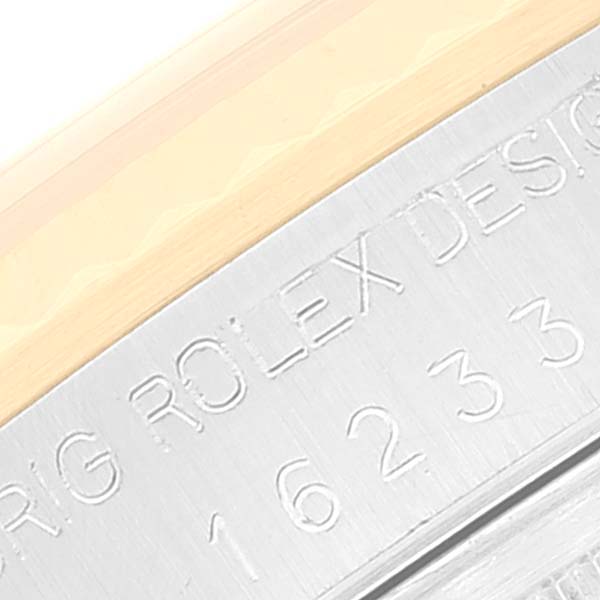 This close-up image shows the engraved model number and "ROLEX DESIGN" text on the case of a Rolex Datejust 16233 Men's Steel and Gold (two tone) Champagne Dial 16233 Men's Steel and Gold (two tone) Champagne Dial watch.