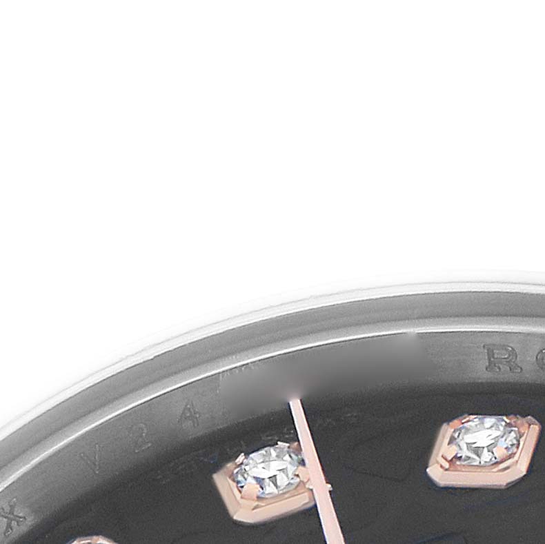 The image shows a close-up of a Rolex Datejust 179161 Women
s Steel and Gold (two tone) Black Dial watch, focusing on the edge of the dial, bezel, and gem-set hour markers.