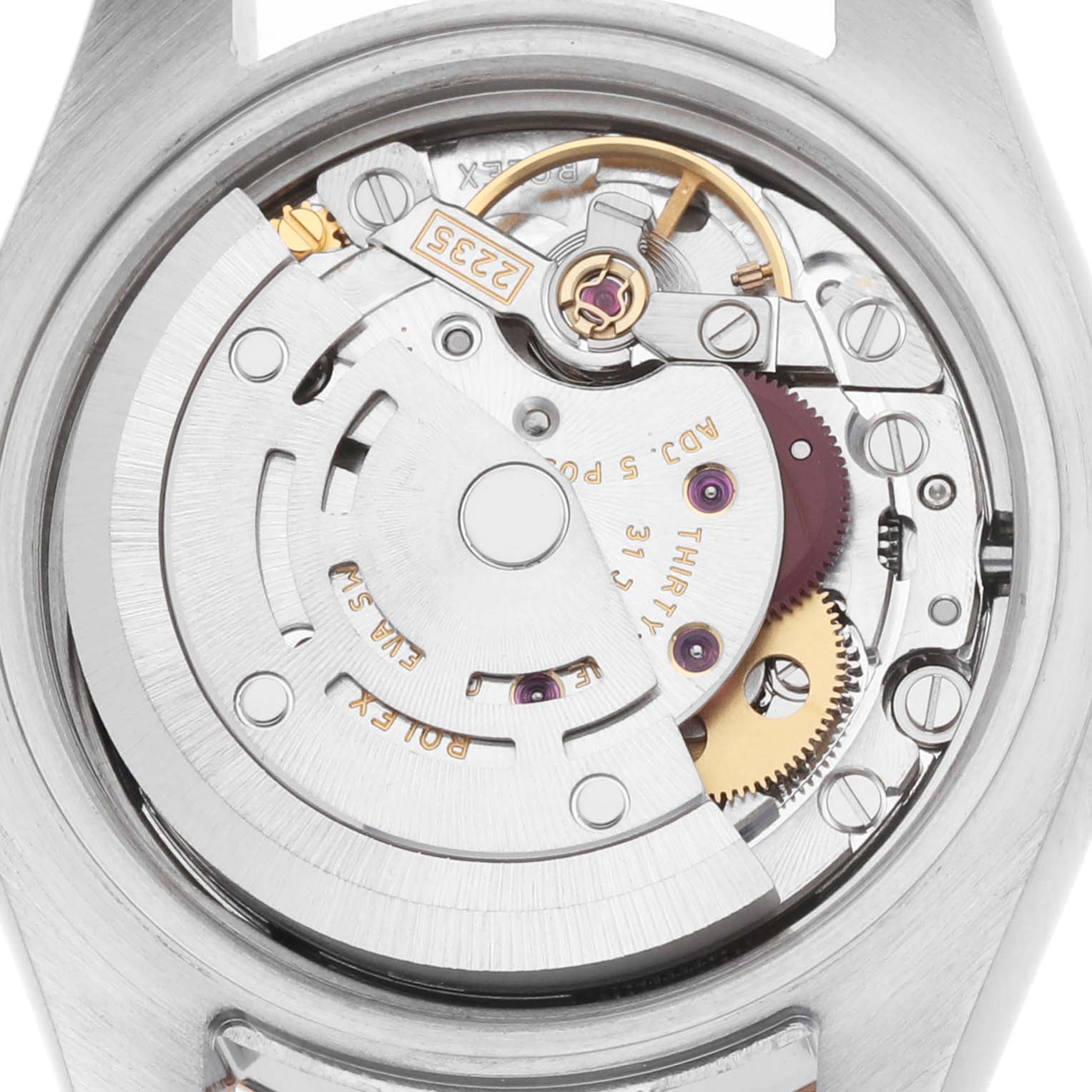 The image shows the movement of a Rolex Datejust 179161 Women
s Steel and Gold (two tone) Black Dial watch from a top-down angle, highlighting gears and components.