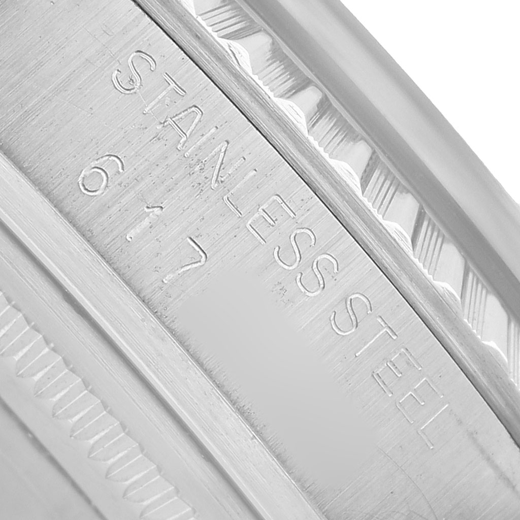 The image shows a close-up of the inner engraving on the bezel of a Rolex Datejust 16030 Men's Stainless Steel Silver Dial, highlighting "STAINLESS STEEL."