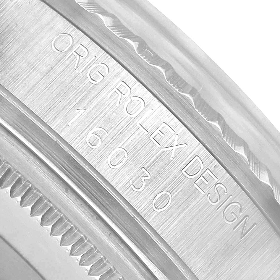 The image shows the engraved side view of the bezel and inner case of a Rolex Datejust 16030 Men's Stainless Steel Silver Dial with the model number "16030".