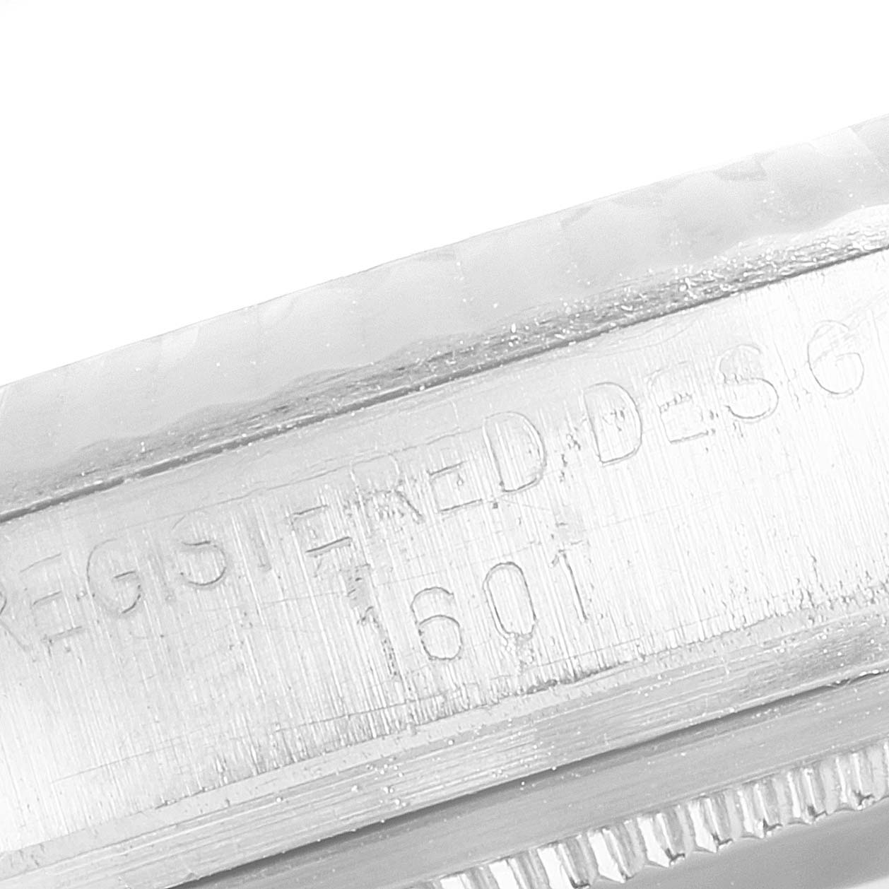 This image shows the engraved model number (1601) on the case side of a Rolex Datejust 1601 Men
s Stainless Steel Blue Dial 1601 Men
s Stainless Steel Blue Dial watch.