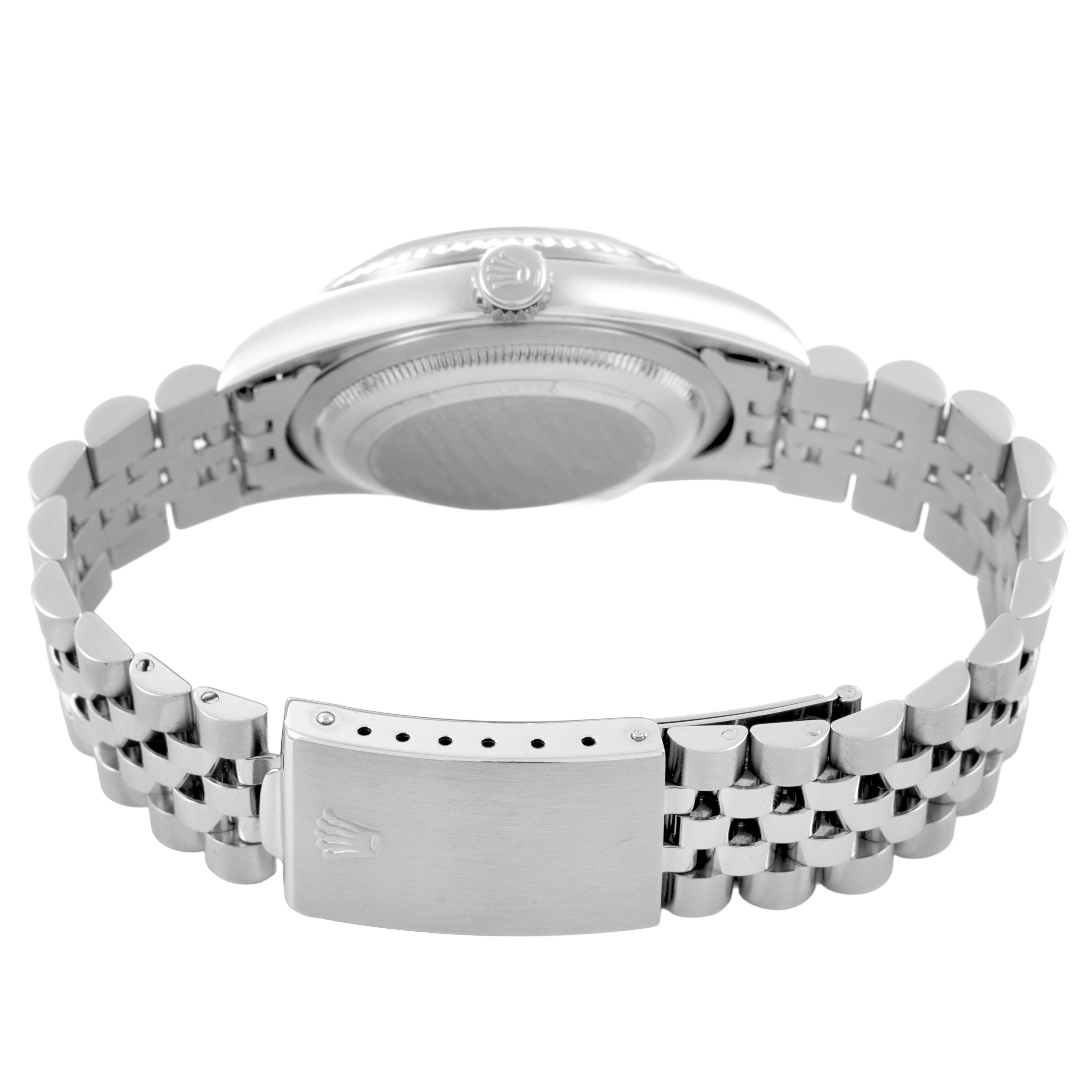 The Rolex Datejust 16234 Men's Stainless Steel Silver Dial watch is shown from the side, focusing on the case back, crown, and bracelet clasp.