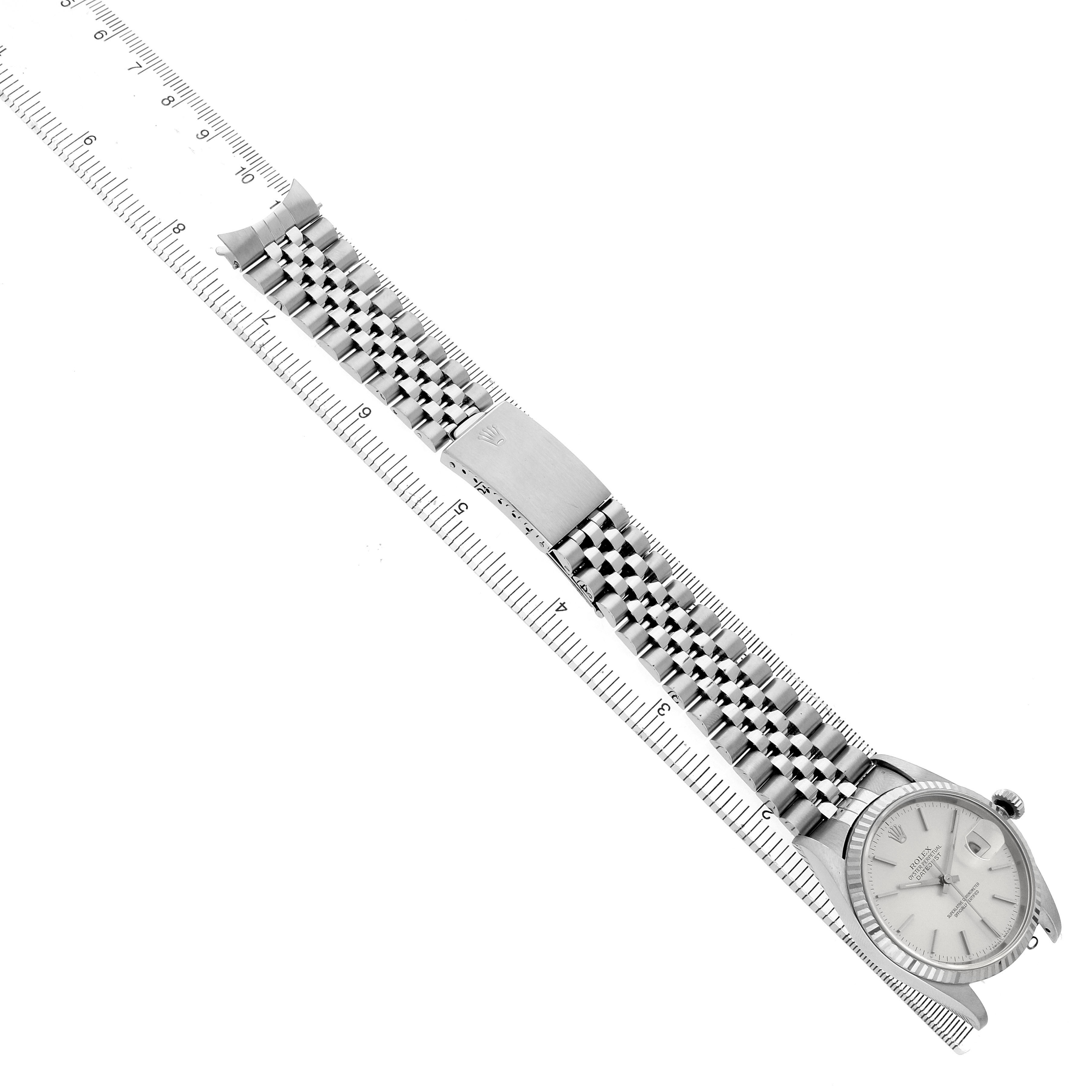 The Rolex Datejust 16234 Men's Stainless Steel Silver Dial watch is shown from an overhead angle, displaying the face, bracelet, and clasp.