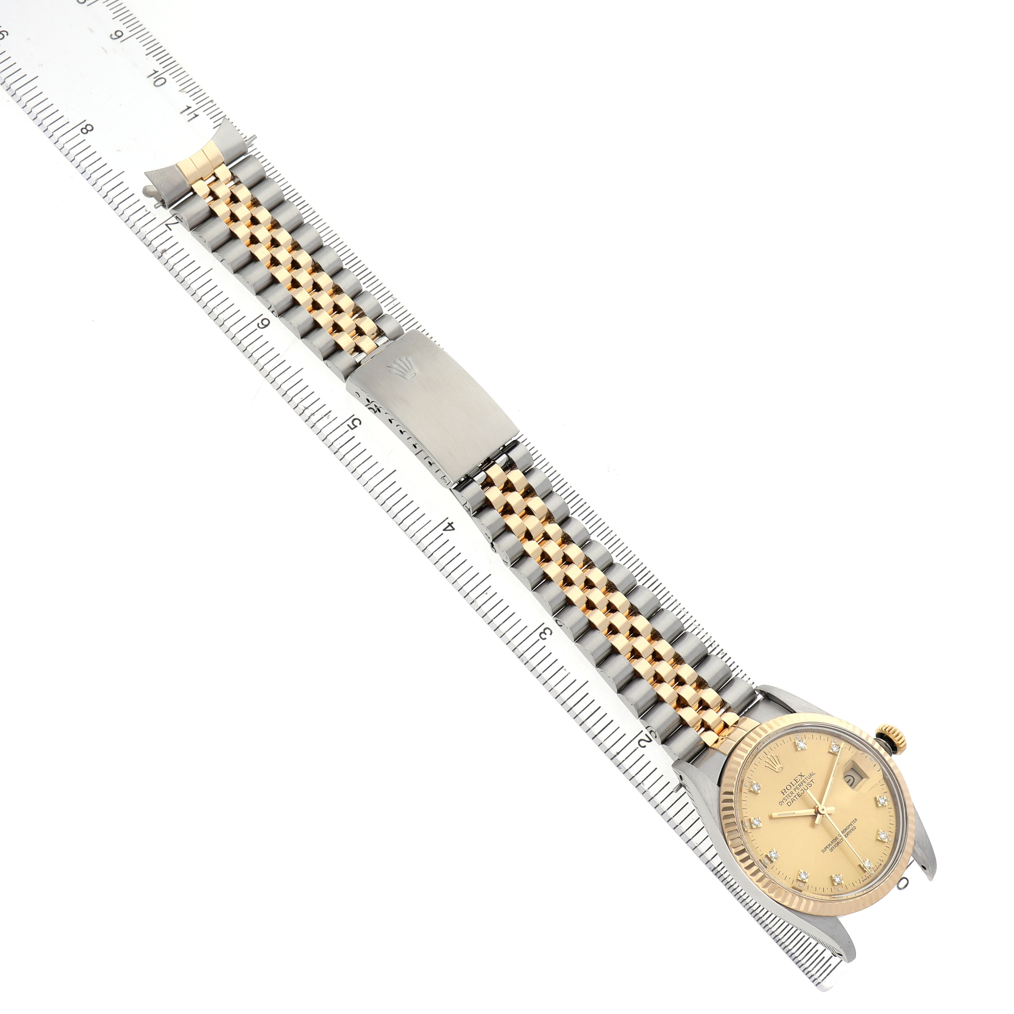 The Rolex Datejust 16013 Men's Steel and Gold (two tone) Champagne Dial watch is shown from a top view, highlighting the face, bracelet, and clasp.
