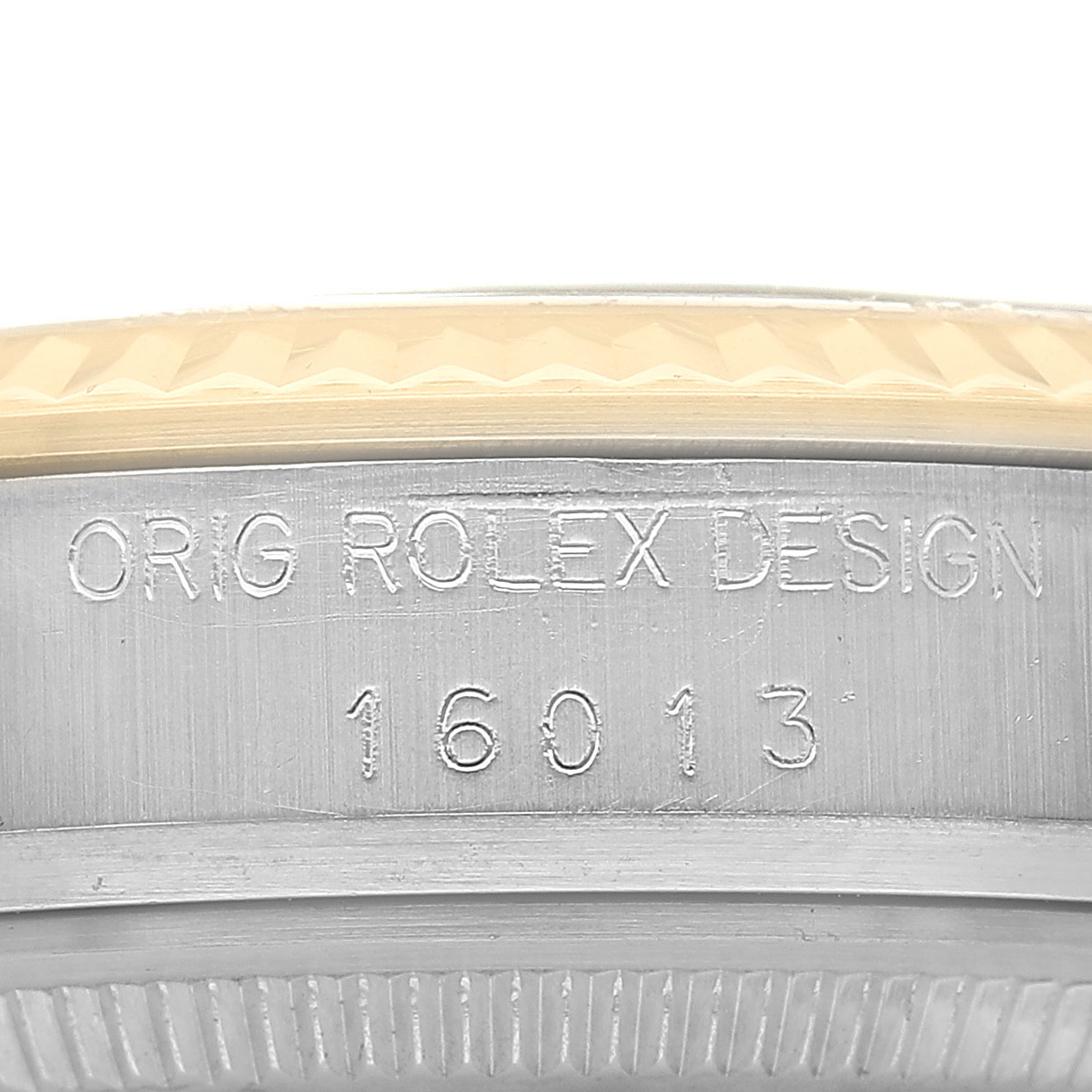 The image shows the side of a Rolex Datejust 16013 Men's Steel and Gold (two tone) Champagne Dial, highlighting the engraved model number and design details on the case.