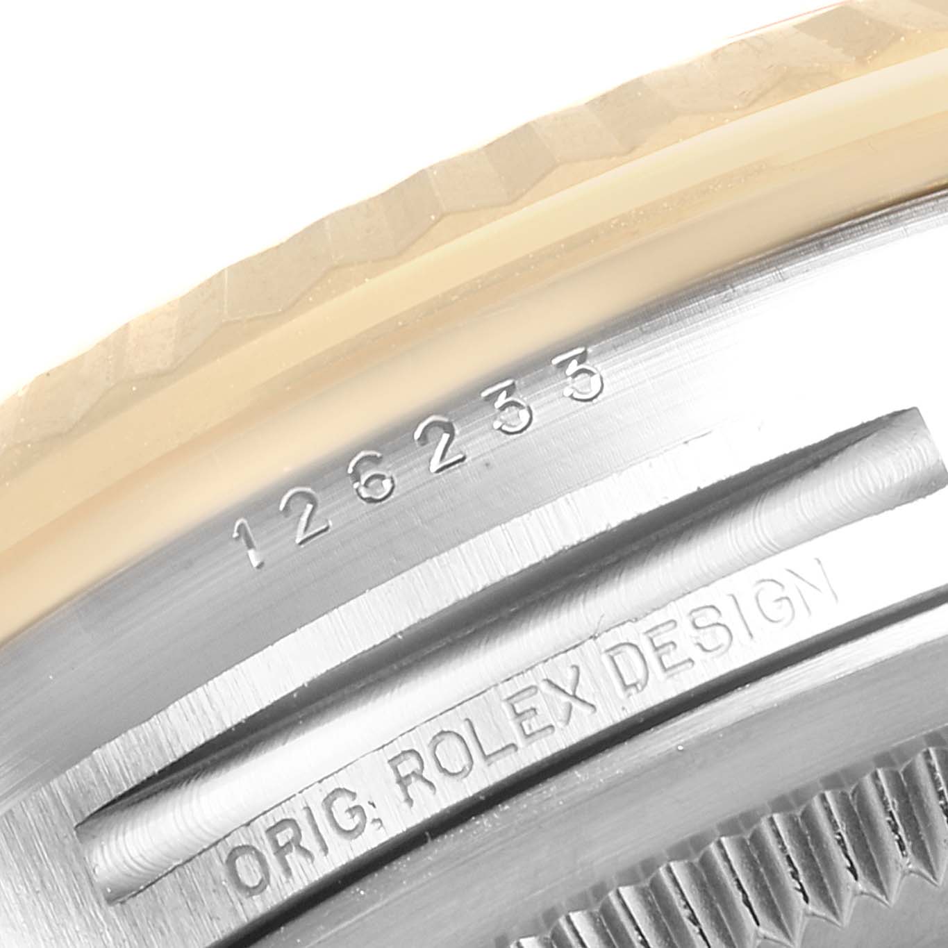 The image shows a close-up of the engraved serial number and "Orig. Rolex Design" on the case of a Rolex Datejust 126233 Men's Steel and Gold (two tone) Champagne Dial.