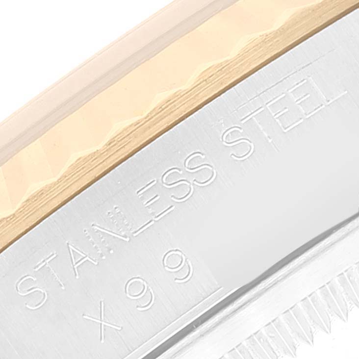 The image shows a close-up of the side edge of the bezel and caseback of a Rolex Datejust 16233 Men's Steel and Gold (two tone) Champagne Dial 16233 Men's Steel and Gold (two tone) Champagne Dial watch, including part of the "STAINLESS STEEL" engraving.