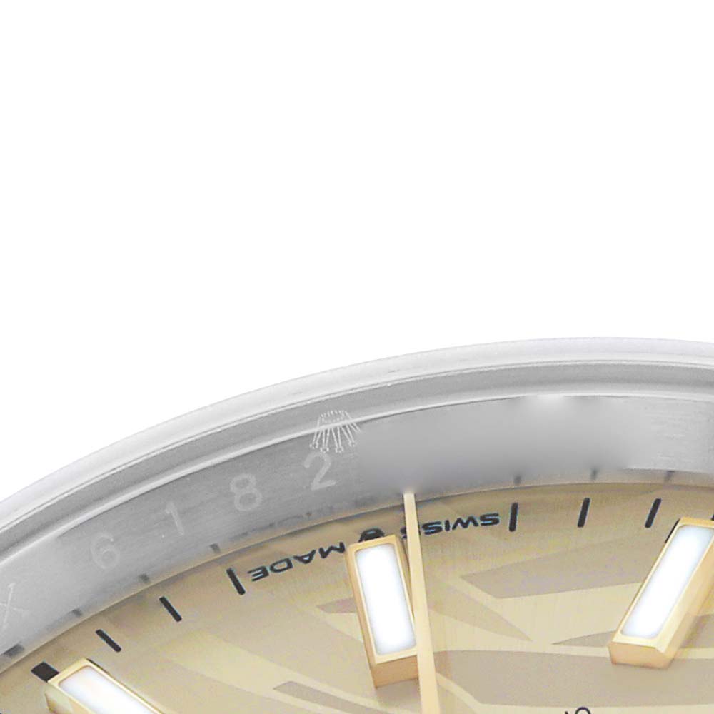 The image shows a close-up of the dial edge and hour markers on a Rolex Datejust 126233 Men
s Steel and Gold (two tone) Yellow Dial, displaying part of the bezel and indices.