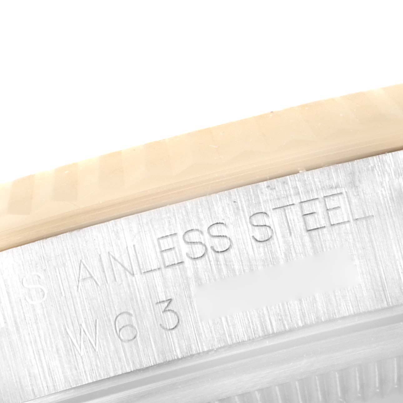 A close-up angle of the side bezel and case of the Rolex Datejust 16233 Men
s Steel and Gold (two tone) Grey Dial 16233 Men
s Steel and Gold (two tone) Grey Dial, showing the "STAINLESS STEEL" engraving.