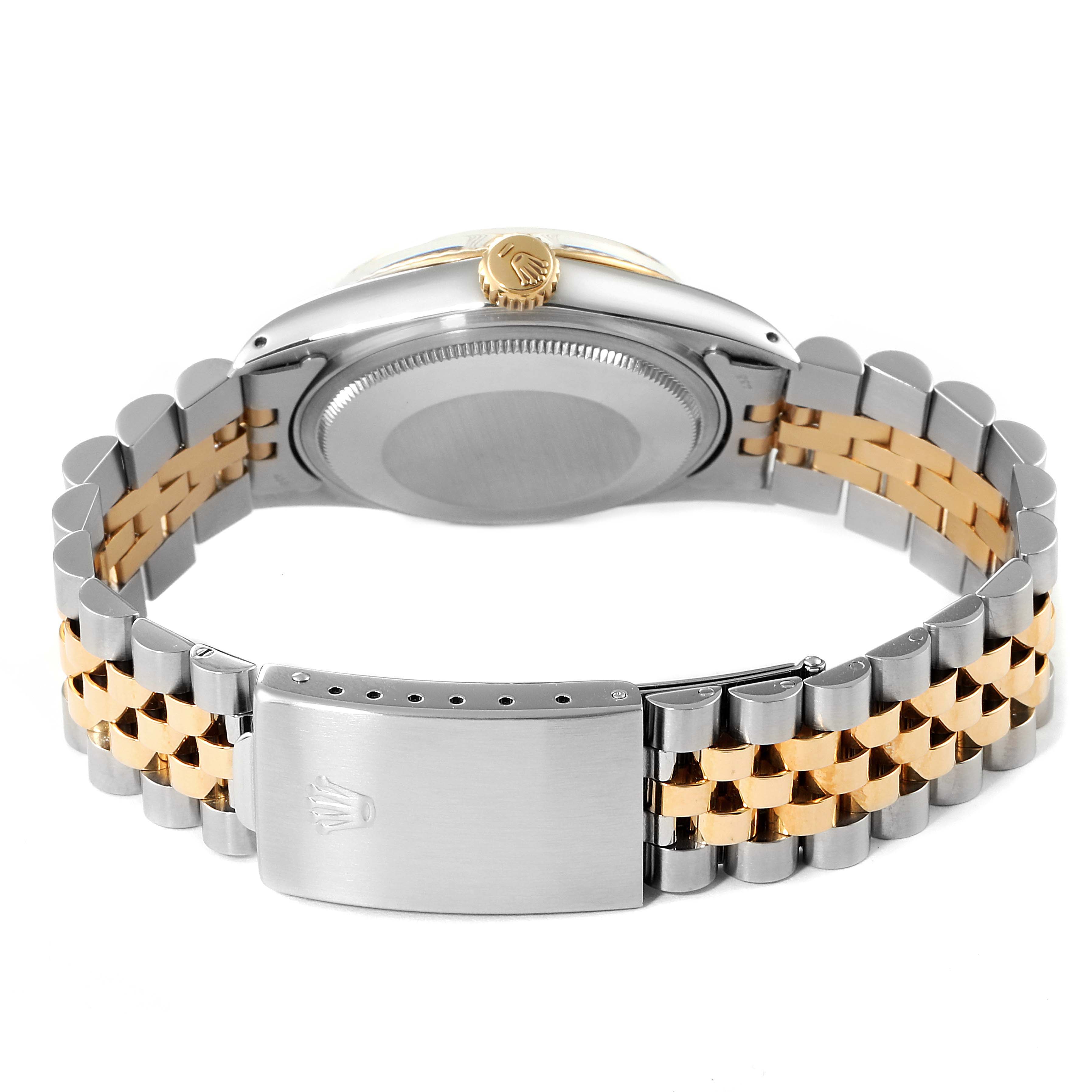 This image shows the backside and bracelet clasp of a Rolex Datejust 16013 Men's Steel and Gold (two tone) White Dial 16013 Men's Steel and Gold (two tone) White Dial watch.